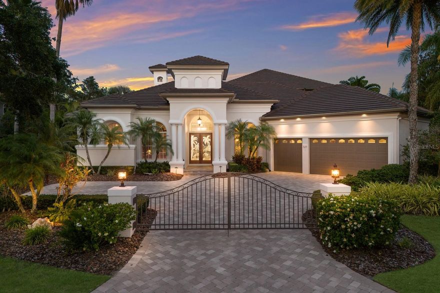**MULTIPLE OFFERS - Highest and best due by 6/20 at 11:59 PM** If only the best will do, then this extraordinary estate was made for you. Cradled in the lap of luxury behind the gates of the highly regarded Lakewood Ranch Country Club, this Arthur Rutenberg masterpiece is breathtaking in every sense of the word. As you arrive, the stately private gate and high-quality finishes catch your eye. The gorgeous front door, lit-up for all to see, welcomes you home with its tropical, bespoke design. Upon entry, pride in ownership can be felt and the space is warm and inviting. Your eyes are instantly drawn to the sliding glass pocket doors where captivating, panoramic vistas await. Prepare to spend days floating in the sparkling pool or decompressing in the spa. The grandiose lanai will become your favored spot to entertain and unwind, setting the stage for sumptuous sunsets and sunrises. Relish in both water and golf course views of the 8th hole, while sipping your cocktail of choice and grilling out the freshest catch, surrounded by loved ones. After all, you’ve earned it. Blending architectural sophistication with thoughtful details, your new abode delivers the perfect balance of comfort, refinement, and everyday livability. All 5 bedrooms are a private retreat, each complimented by an ensuite bathroom. Robes and slippers not included, but highly recommended! The kitchen is a culinary enthusiast’s dream—stone counters, dual sinks, premium appliances, huge twin column 72-inch refrigerator (2024) and a butler’s pantry with wet bar pass-through, making dinner parties a joy. Ensconce yourself in all of the fine features in store: A fenced-in yard paired with a separate fenced-in space for pets, elaborate wood and bamboo tray ceilings adorned with accent lighting, paneled wood walls, wood floors, an expansive 2nd floor bonus room featuring a kitchenette and, most impressively, your very own wine room with capacity to showcase over 700 of your favorite bottles! The winterized upstairs balcony offers brilliant views, and both the downstairs and upstairs outdoor spaces feature electric drop-down screens. The oversized insulated garage, complete with an air-conditioned storage room, provides ample space for your vehicles, golf cart and workspace. For your peace of mind and utmost satisfaction, upgrades include: a brand new top-of-the-line roof with 2-ply underlayment (2024), a whole house 30kw Kohler generator (2018), a new in-wall oven (2025), freshly painted exterior (2025), new microwave (2025), new washer (2025), rescreened pool cage (2020), a tankless hot water heater with circulating pump and an in-wall pest system. Ideally positioned within one of the nation’s most desirable master-planned communities, this stunning residence offers an elevated lifestyle in the heart of Lakewood Ranch. The location is savored for its remote serenity yet close proximity to the best that the area has to offer. From our world-renowned beaches, to an eclectic arts and community events scene, to local boutiques and mouth-watering dining experiences, everything you need—and plenty that you simply desire—will be right at your fingertips. This house is more than a home. It is a statement…a sanctuary ready to be treasured.