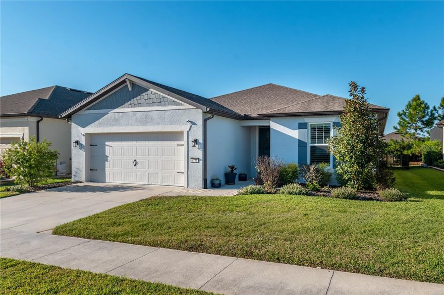 Expanded Mystique model is awaiting your next chapter in comfort and style. Located in the gated, sought-after active 55 + community of Stone Creek Golf Course Community. This move-in ready home is designed for comfort and class. The home features a third bedroom with a Murphy Bed and an additional flex room. Luxury Vinyl and tile is tastefully thought out throughout the home, complemented by Plantation shutters. The extended birdcage lanai overlooks a fenced back yard with a private feel and a relaxing hot tub. Open floor plan, high ceilings and custom backsplash make this home stand out. Owners suite offers a spacious walk in closet, private bath featuring a Roman-style walk in shower, dual sink vanity, chic glass tile inlay and a transom window for added light. Oversized laundry room, with an upgraded water system, folding table and plenty of storage. The garage, has an additional four feet for tools, bikes or golf cart. Modern Smart Home technology already built in so you can enjoy a connected, convenient lifestyle. Stone Creek is packed with amenities that elevate everyday living. Resort style pools, health spas, live entertainment, tournaments, and curated trips all in one beautiful location.