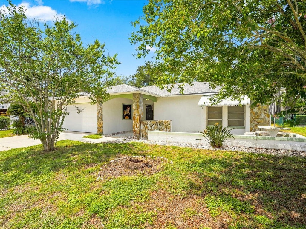 Photo of 11121 Rollingwood Drive, Port Richey, FL 34668 (MLS # W7889231)