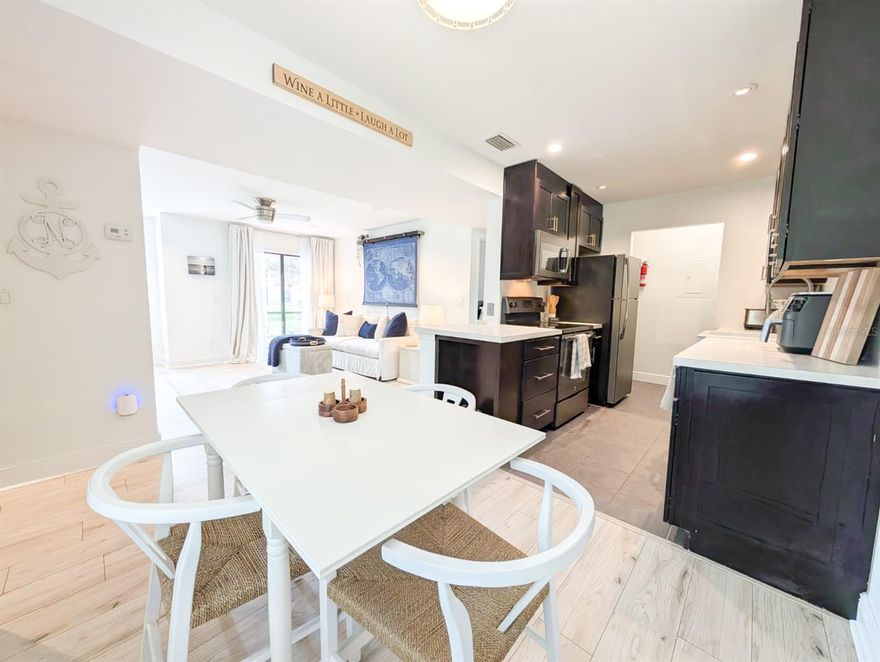 Welcome to this beautifully updated first-floor 1-bedroom, 1-bath condominium located in the highly desirable Landings at Belle Rive community.
Thoughtfully remodeled, this residence offers keyless entry and stylish wood-look flooring throughout, creating a clean, modern feel.
The kitchen features 42-inch soft-close espresso cabinetry, stainless steel appliances, a farmhouse-style sink, built-in pantry storage, and
an open-concept layout ideal for both everyday living and entertaining. Additional highlights include a wood-burning fireplace, USB charging outlets,
and full-size washer and dryer connections conveniently located within the unit.The spacious bedroom easily accommodates a king-size bed
and offers a large walk-in closet. The bathroom is appointed with a double-sink vanity and a walk-in shower. Step outside to the screened lanai and
enjoy peaceful lake and fountain views, along with two additional storage closets for added convenience.
Ideally situated just one exit from St. Johns Town Center and Tinseltown, with easy access to Downtown Jacksonville, Riverside,
the Beaches, Mayport, and NAS—most destinations are within 15–20 minutes, traffic permitting.
This move-in-ready condo combines comfort, style, and location—an exceptional opportunity in the heart of Jacksonville.