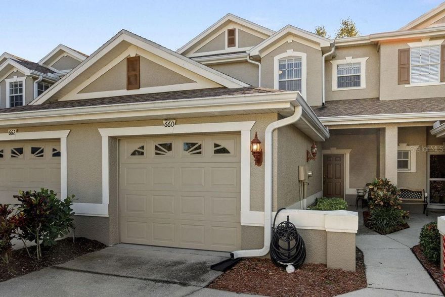 Looking for a newer home in a sought after gated community? Look no more! This beautiful Tarpon Springs townhome sits on a street with sparse traffic in a NON flood zone. Home offers a bright, open plan with high ceilings and includes the following: covered front porch, welcoming foyer, spacious living and dining areas, open kitchen with breakfast nook, large master suite with private bath & walk-in closet, office or guest bedroom, upstairs full bath and laundry room, ground floor powder room, 1-car garage, PLUS a rear screened lanai and patio... PERFECT for your morning coffee & evening glass of wine. The abundant ground floor living space with outdoor porch and paved patio make this home great for entertaining! This particular townhome is back off the street with a longer double driveway, allowing for more vehicle parking. Property has been lovingly cared for and features newer light fixtures, ceiling fans, LED lights with dimmers, garbage disposal - PVC pipe & trap with drain, thermostat, shingle roof (2018), and A/C system (2019). Townhomes at North Lake is a meticulously maintained, tropically landscaped, lakefront community with mature plants, shrubs, palms, majestic trees, and lush green lawns. Amenities include: nicely paved gated entry, fenced common areas, private mailboxes, sidewalks, guest parking spots, and a tranquil recreation area with refreshing lakefront pool and fishing dock directly ON Salt Lake. It is ideally located just off the beaten path yet near everything! For bicyclists, the Pinellas Trail extension is adjacent to the community. A short drive away is Lake Tarpon, several shopping hubs, countless restaurants, historic downtown Tarpon Springs, the famous Sponge Docks, and the sandy beaches of Howard Park. This is a MUST SEE for buyers seeking a maintenance free townhome in a desirable gated community.