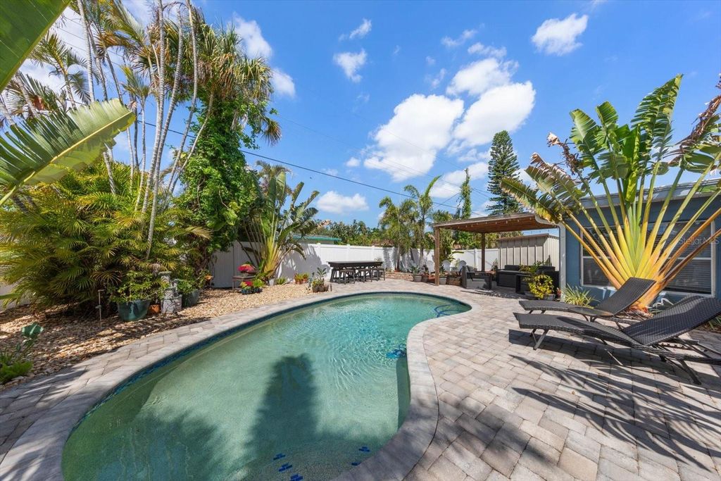 Photo of 5042 Lake Charles Drive N, Kenneth City, FL 33709 (MLS # TB8495562)