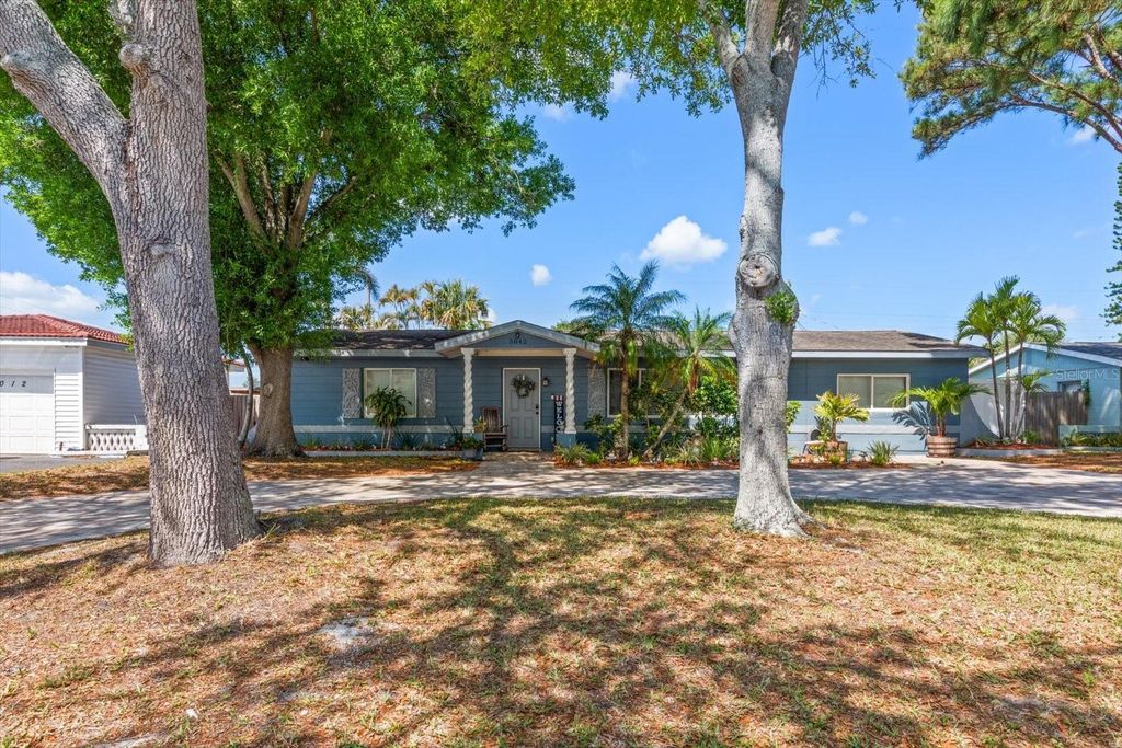 Photo of 5042 Lake Charles Drive N, Kenneth City, FL 33709 (MLS # TB8495562)