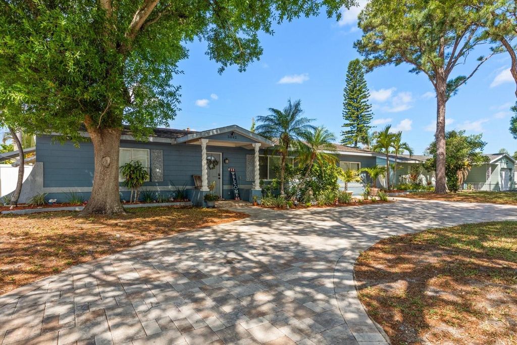 Photo of 5042 Lake Charles Drive N, Kenneth City, FL 33709 (MLS # TB8495562)