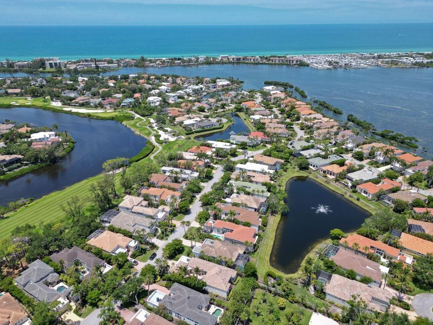 Experience refined coastal luxury in this impeccably renovated 4,154-square-foot golf course estate, ideally positioned within the exclusive Queens Harbour enclave of gated Bay Isles on Longboat Key. This extraordinary two-story residence offers 4 bedrooms, 4.5 bathrooms, and an elegant open floor plan thoughtfully curated with exquisite finishes and designer details throughout. Extensive recent enhancements include a newer roof (2021), new panoramic pool cage with picture-frame screening (2025), new hurricane Armor Screen shutters protecting every opening (2025), and a custom two-person Pneumatic Vacuum elevator, along with numerous additional upgrades and improvements.

Dramatic two-story windows fill the expansive great room and chef’s kitchen with natural light while showcasing breathtaking views of the sparkling pool, serene lake, lush landscaping, majestic oak trees, and the manicured fairway. Designed for both everyday living and entertaining, the gourmet kitchen is a culinary masterpiece, complete with a large gas range, dual ovens, solid wood cabinetry, abundant counter space, and a charming breakfast nook framed by bay windows overlooking the pool and golf course.

The luxurious first-floor owner’s retreat offers Brazilian cherry wood flooring, vaulted ceilings, French doors opening to the lanai, dual walk-in closets, and a spa-inspired bathroom. Two additional guest bedrooms on the main level are connected by a beautifully appointed Jack-and-Jill bathroom.

Outdoor living is equally exceptional, with an oversized pool and spa set within a spacious private lanai designed for relaxation and entertaining while enjoying tranquil sunsets over the lake and golf course. Residents of Queens Harbour enjoy maintenance-free living, a private community pool, and exclusive access to the Bay Isles Beach Club with deeded Gulf beach access. Ideally located near the Longboat Key Club Harbourside golf course, tennis facilities, and the Moorings Yacht Club, this residence embodies the finest in Longboat Key luxury living.