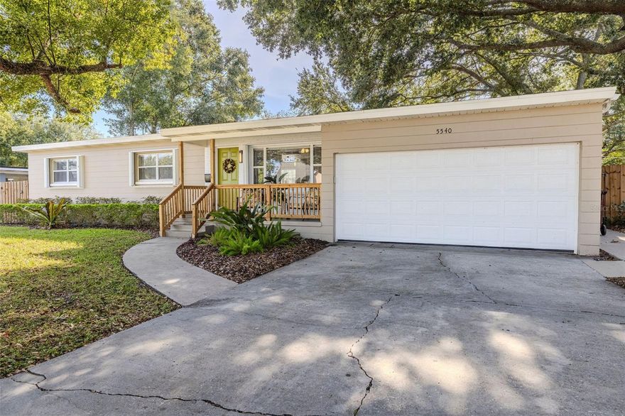 Welcome to this beautifully remodeled mid-century modern home in Orlando! With over 1400 square feet, this three-bedroom, two-bath residence features fresh interior paint and an inviting open floor plan that seamlessly connects the kitchen, dining, and living area. The kitchen is a chef’s delight, featuring granite countertops, newer stainless steel appliances, and no touch faucet.  Gorgeous original hardwood floors run through most of the property, with water resistant vinyl in the kitchen, bathrooms, and family room. The additional family or bonus room offers extra space and flexibility, and it’s conveniently connected to the oversized two-car garage, which features a new raised side door, new wind resistant main garage door, motor and tracks, beautiful finished flooring and a vaulted ceiling, perfect for extra storage.The property has been meticulously updated, including newer blinds and shutters throughout, a brand-new hot water heater, updated electrical, and a new thermostat. The roof has recently been professionally soft-washed and insulated, and the entire home has been repiped.  Outside, enjoy professionally landscaped front and back yards, a new no-show six-foot wood fence with multiple gates, a permanent metal gazebo with electricity connected, and a new leaf filter gutter system that connects to rain barrells in the backyard. The front and back porches have been updated with matching wood railing. The backyard porch is enhanced with a brand-new stair lift for added accessibility, and a concrete walkway beautifully outlines the backyard. Conveniently located near the 408 Expressway, enjoy a stress free commute to work, play or travel to the airport.  Zoned for Boone High School.
