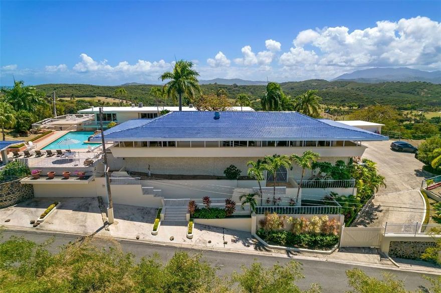 Enjoy the panoramic ocean views overlooking the east side of the island in the Las Croabas village of Fajardo! Located in close proximity to the golf course of El Conquistador Resort, this property seated on over 2 acres of land would make a magnificent vacation home or a great investment opportunity. Watch breathtaking sunsets from the expansive balconies and terrace areas, and enjoy the warm weather with the home’s wet bar, 70,000 gallon swimming pool, full-size steam room, sauna, and gym. The sale includes valuable furniture and local art as well as a full service 50kW generator that powers the entire property. Also included are separate living quarters and a helipad. Great location, within a short driving distance from fabulous restaurants and boating marinas.