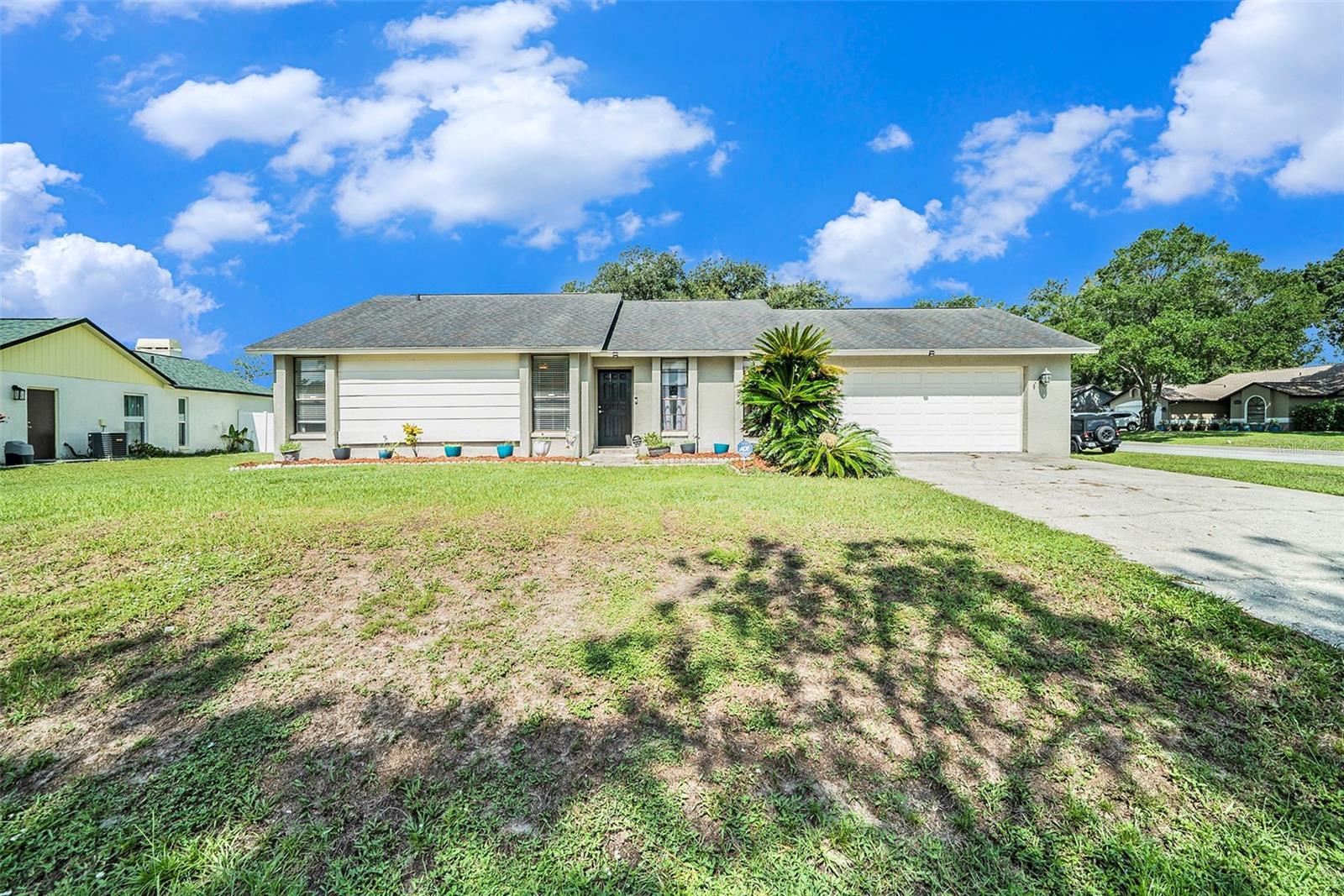 Charming 3 bedrooms, 2 bath, 2 car garage home in the desirable community of Lake Padgett Estates East. Split floor plan with tons of natural lighting. Kitchen has ample counter space with plenty of cabinets for storage and stainless steel appliances. Located on corner lot with oversized, fully fenced backyard. The large lot provides ample room for playing, gardens, and whatever your heart desires. Roof was replaced in 2017. NO CDD fees and Low HOA fees! Conveniently located close to schools, hospitals and restaurants. Make your appointment today to see this home! Buyer to confirm measurements.