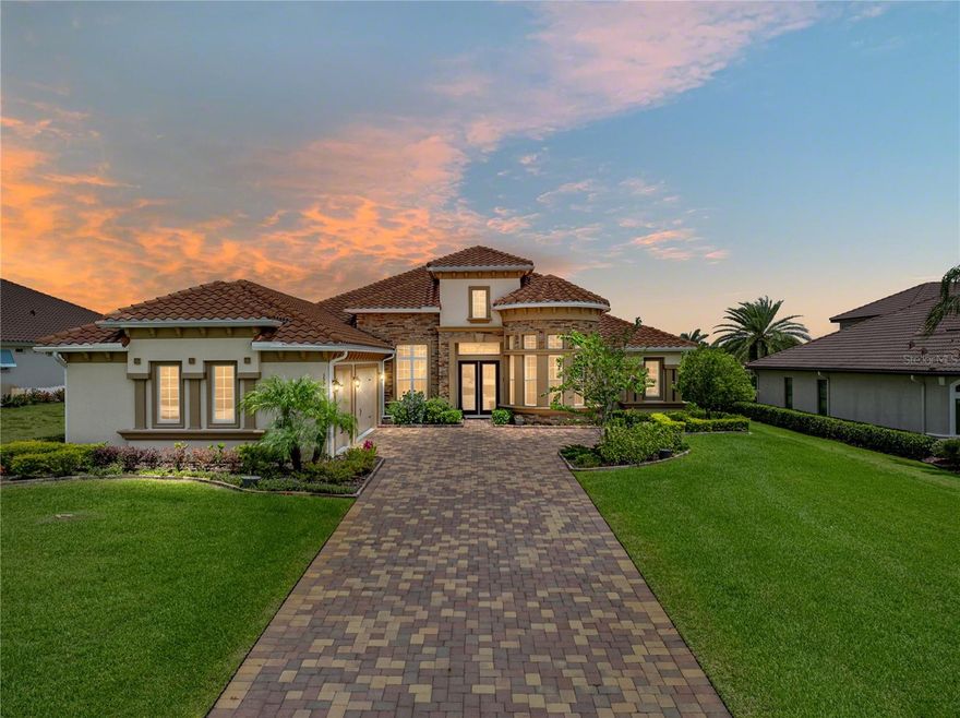 Located in the much sought-after community of Lake Jovita Golf & Country Club. This gorgeous 3,613 sf home, with 3-car garage, is set on a lovely, large and level .65-acre lot.  Built in 2022 by ICI Homes, it offers a modified, expanded version of the popular Egret V model. The primary bedroom closets were enlarged, a spacious hidden pantry was added, and the “icing on the cake” is the gorgeous lanai sunroom addition. Quality construction, design features and upgrades are evident throughout this beautiful home. The well-appointed open floor plan begins with the large and impressive rotunda office, featuring a wall of windows and 12-foot ceilings, a dining room area, and a huge great room. Quadruple sliders, coupled with transom windows in the great room and sunroom, provide wide-open views and abundant natural light throughout the main living areas.  The gorgeous sunroom seamlessly transitions to the pool area, thanks to the large sliding glass doors, and the dedicated, remote-control air conditioner that creates a comfortable outdoor or indoor space for relaxing and entertaining, regardless of the season. The home offers plenty of private spaces for all. The roomy primary bedroom suite will be your private retreat, with two oversized walk-in closets and a fabulous bathroom. Family and guests will appreciate the split-bedroom floor plan with 3 guest bedrooms and 2 guest baths, including private access to the lanai from the rear bath. The screened lanai oasis features a beautiful, heated saltwater pool, a separate covered area, PLUS the open, covered sunroom and room to relax and dine in the sun. The dream kitchen, with cooktop, stainless steel exhaust hood, smart refrigerator, wall oven and convection microwave, is loaded with beautiful cabinets, including hidden cabinets in the large island, with seating for 4, a coffee bar, plus the large hidden pantry.  If you desire even more storage and workspace, the guest bedroom behind the kitchen has been converted to a large butler pantry or hobby room. For those that prefer to use this hobby room as a bedroom or den, the seller will remove the cabinets and restore the room before closing. Numerous other special features and upgrades include: 12 ft ceilings with accented trays, crown molding and gorgeous, plank luxury vinyl flooring in the main living areas. Also, an irrigation well that keeps your lawn and landscape lush, without breaking the bank, a security system, water softener, beautiful landscape lighting, flood lights, shutters, plus an energy-efficient water heater with recirculating pump that quickly delivers hot water to all faucets. These owners thought of everything when designing this home and spent much time, money and effort to ensure all aspects of construction were completed accurately and to the highest standard. You'll love our beautiful, gated, resort community with low HOA dues, 2 championship golf courses, tennis courts, fitness center, community pool, basketball & pickleball courts, a beautiful park with paved walking path, a playground and separate dog parks for small and larger dogs. We are located near excellent shopping, restaurants, medical & educational facilities, and unlimited entertainment options.  Located only five miles from I-75, with easy access to other major highways and two international airports.  Don’t miss your opportunity to own this distinctive home and enjoy all the Lake Jovita and Greater Tampa & Orlando Region have to offer.