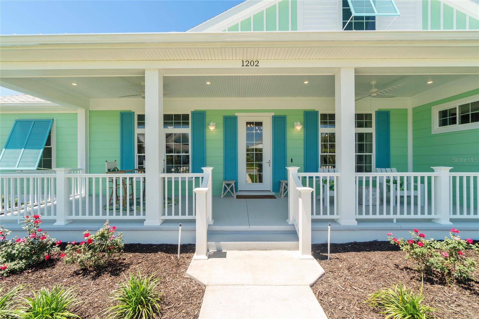 A Home That Speaks Your Language of Luxury. If your lifestyle demands excellence, this Duval model in Green Key Village rises to the occasion with bold design, expansive living space, and a host of high-end features. Boasting 4 bedrooms, 3.5 bathrooms, a versatile flex space, and an impressive 4,395 total square feet, this home is tailored for those who love to entertain, host extended family, or simply indulge in everyday luxury.
Step into a grand interior where tongue & groove wood ceilings with exposed beams, a linear gas fireplace with stacked stone surround, and custom twin built-ins set the stage for stylish living. The chef’s kitchen is a showstopper with shutter-style maple cabinetry, Cambria quartz countertops, a cast iron farm sink, and top-of-the-line appliances, including a wine and beverage cooler. Every interior door is 8’ tall solid core, and the luxury plumbing and lighting fixtures elevate each space. The owner’s retreat is a private sanctuary featuring French doors that open to a serene lanai, remote-controlled silhouette and blackout shades, and a spa-inspired bathroom with a massive luxury shower. Additional comforts include dual water heaters, a whole-home water softening system, epoxy-finished garage flooring, and pre-wired outdoor surround sound. Outside, this home truly shines with a resort-style pool (2023) featuring a lap lane, sun shelf, and XL flush spa, all enclosed by a picture-frame screen cage and surrounded by lush, tropical landscaping with a French drain system. Entertain year-round at the custom Blaze Professional Series outdoor kitchen complete with infrared burner, rotisserie, side burners, ice maker, refrigerator, and sink all powered by an in-ground propane system. Enjoy evenings around the sunken firepit with built-in seating, and celebrate the seasons with custom roofline holiday lighting.
Built with sustainability and durability in mind, this home includes a solar array system offering little to no energy bills, 2x6 frame construction with spray foam insulation, 40-year CertainTeed architectural shingles, insulated garage doors, and plantation and Bahama shutters on the front elevation.This is not just a home it’s a lifestyle
