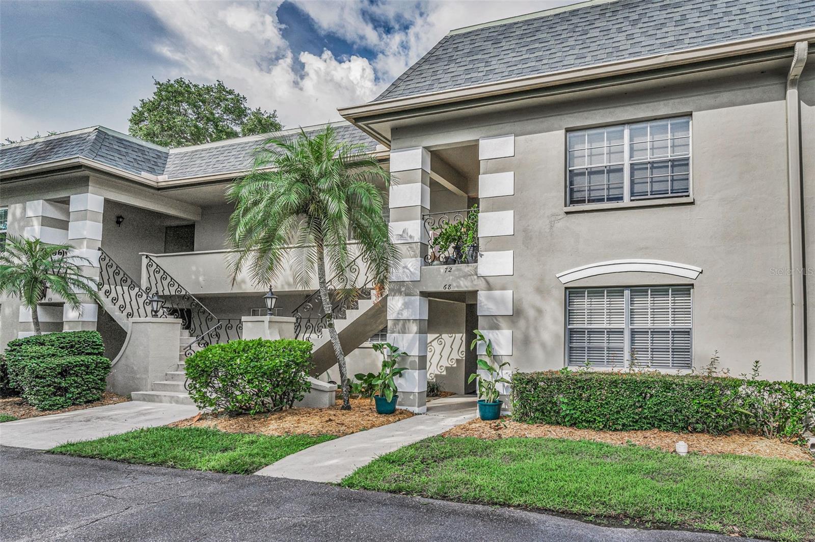 One or more photo(s) has been virtually staged. One or more photo(s) has been virtually staged. This spacious 1st floor condo directly on the golf course is ready to move into. As you walk up to the front door, you will appreciate the large covered entryway that protects you from the elements. Upon entering the condo, you will see that the kitchen opens onto the dining area and living room, all with sweeping views of the golf course. There are also wall-to-wall sliders onto a screened patio, where you can enjoy your morning coffee or an afternoon cocktail while enjoying the flora and fauna and peaceful surroundings. The kitchen has granite countertops with a breakfast bar and a closet pantry. The 15' x 18' living room area allows for a variety of furniture scenarios and/or office space. The bedrooms are generous in size. The primary bedroom has its own en-suite bath with a newer shower enclosure. The 2nd bedroom has a large walk-in closet. Both bathrooms have granite countertops, and the hallways host lots of extra closet space. The screened porch houses the laundry closet with hook-ups for a washer and dryer. You also have a reserved carport space (#68) and guest parking. Don't let this one pass you by!
