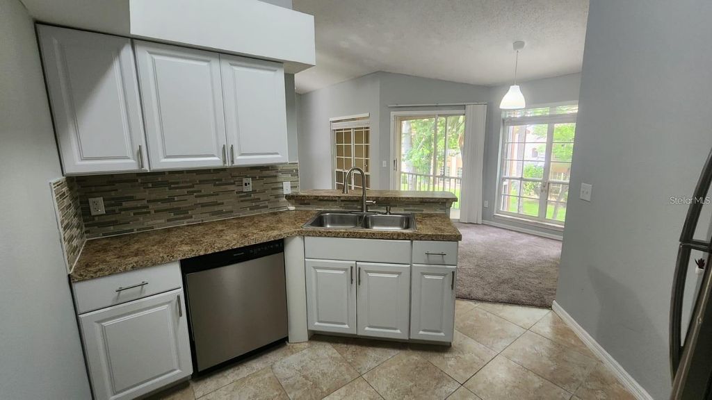 Photo of 4680 Sussex Terrace #206, Orlando, FL 32811 (MLS # O6376991)