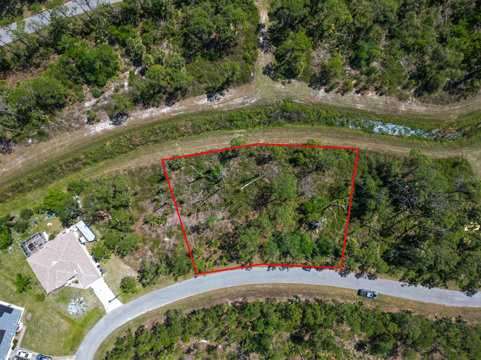 DOUBLE-LOT ALERT!! This nearly 1/2 acre property is tucked away on a secluded greenbelt in North Port, yet it’s just minutes from I-75, making trips to Sarasota, Venice, Port Charlotte, or even Naples quick and convenient. You’ll also be just a short drive from Wellen Park, a new community full of shops, dining, parks, walking trails, live entertainment, and the Atlanta Braves Spring Training stadium.The City of North Port continues to pop with new homes, schools, and businesses, which makes this the perfect time to secure your piece of land here in Sarasota County. With no HOA restrictions, you’ll enjoy the flexibility of designing your dream home, plus you’re close to Gulf beaches, golf courses, and beautiful nature preserves! Whether you’re dreaming of building your forever home or looking for a smart investment, this location checks all the boxes. And if you’d like assistance on the building process, our trusted custom home builder is available to walk you through every step and answer your questions!