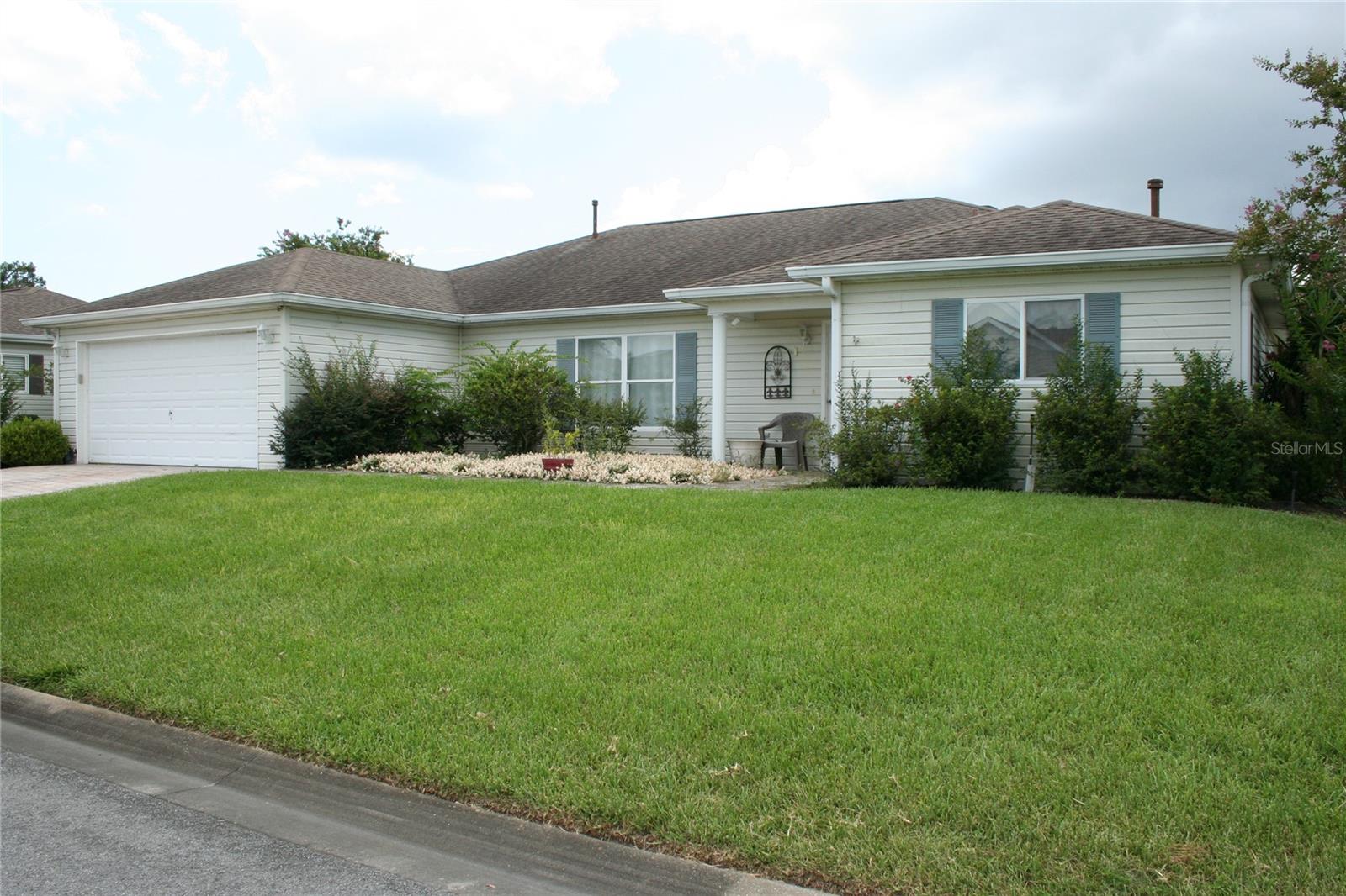 This Palm II Model is close to the clubhouse for convenience. Del Webb Spruce Creek Golf and Country Club is an award winning 55+ Community with numerous activities and clubs to choose from. There are 9 - hole golf courses, 3 pools, one indoor pool, fitness center, restaurant, walking paths and the list continues. This community is near outside conveniences such as Restaurants, Banks, Medical Facilities, Retail Stores, Personal Services, etc.. This home has a special room at the end of the garage giving entry through the utility/laundry room into kitchen area, it also has a picture window for observation to the street and garage when the door is open. Kitchen has pass through access window into the den for additional seating to dine or relax. Living/dining room are spacious with easy access to kitchen. Den has vertical blinds for light and privacy control. Home has Solar system with a new "inverter" recently installed. Extra refrigerator in garage remains. Exterior has mature landscaping with both flowering and fruit producing bushes and trees. Florida room is spacious. Master bedroom has walk-in closet as well as a strip closet. Occupancy is on closing date.