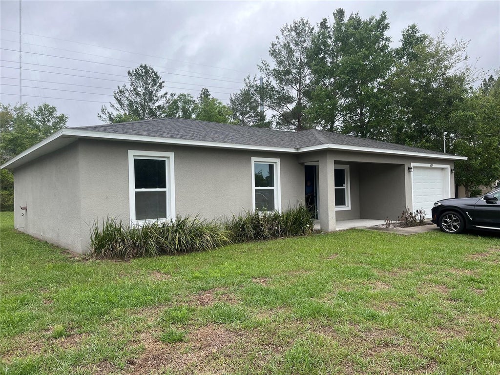 Photo of 619 Hickory Avenue, Orange City, FL 32763 (MLS # S5151115)