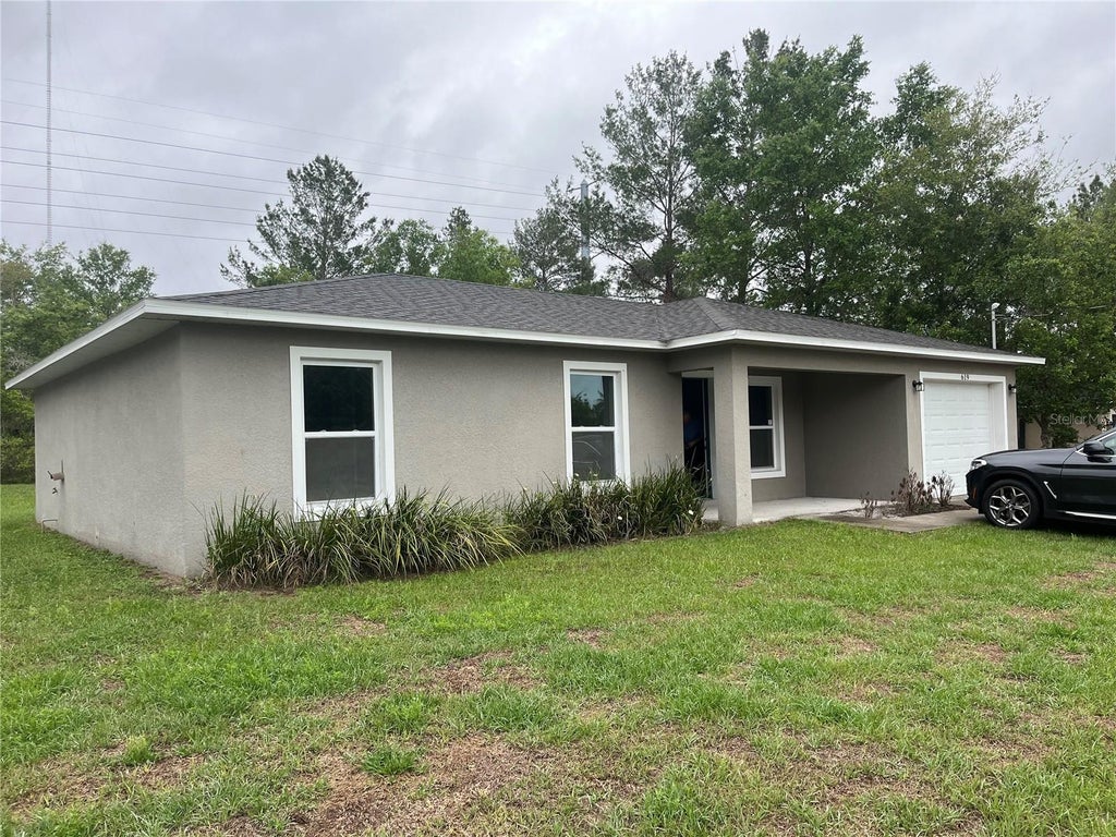 Photo of 619 Hickory Avenue, Orange City, FL 32763 (MLS # S5151115)