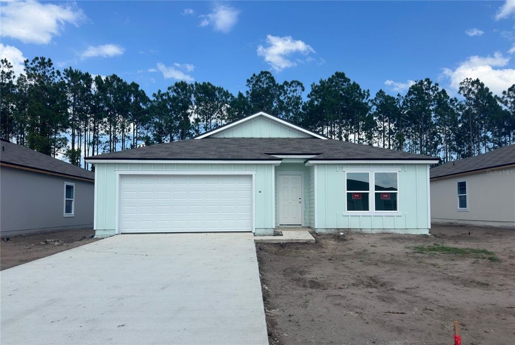 Photo of 90 Hulett Woods Road, Palm Coast, FL 32137 (MLS # FC299493)