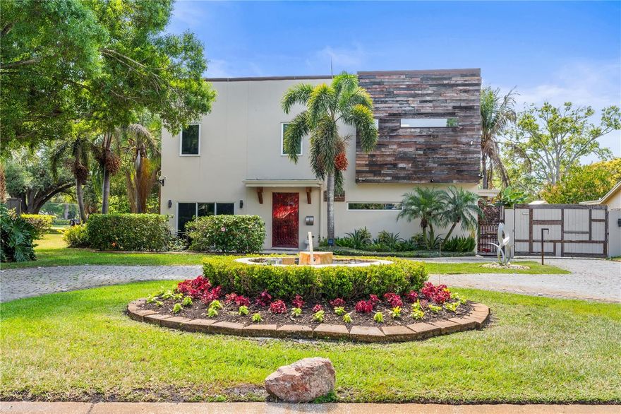 Exceptional oasis-style estate in a desirable golf community, featuring fully-owned solar for maximum efficiency and savings. Resort-style outdoor living includes a heated and cooled pool and spa, expansive entertaining area with grill, and lush, mature vegetation throughout the property creating a private, serene setting. The open-concept first floor is designed for both everyday living and entertaining, featuring a spacious great room, dining area, and kitchen, along with a private primary suite complete with two walk-in closets and en-suite bath. The second floor offers four bedrooms, including one with a private balcony, providing flexible space for family, guests, or home office needs. The detached ADU above the garage offers a fully equipped 2BR/1BA apartment—ideal for multi-generational living or income potential. Interior highlights include full ethernet wiring, a custom built-in aquarium that conveys, and a climate-controlled 3-car garage. The home is equipped with a whole-home generator with gas tank, whole home water treatment system; plus, a fully irrigated yard enhanced by low-voltage landscape lighting. Extensive parking includes an extended driveway behind an electric automatic gate, along with a 50’L x 20’W x 20’H carport/storage structure ideal for RV or boat storage. Fully fenced property with automated gated entry and sections of solid concrete wall for added privacy. A spacious second-story deck provides additional outdoor living space.