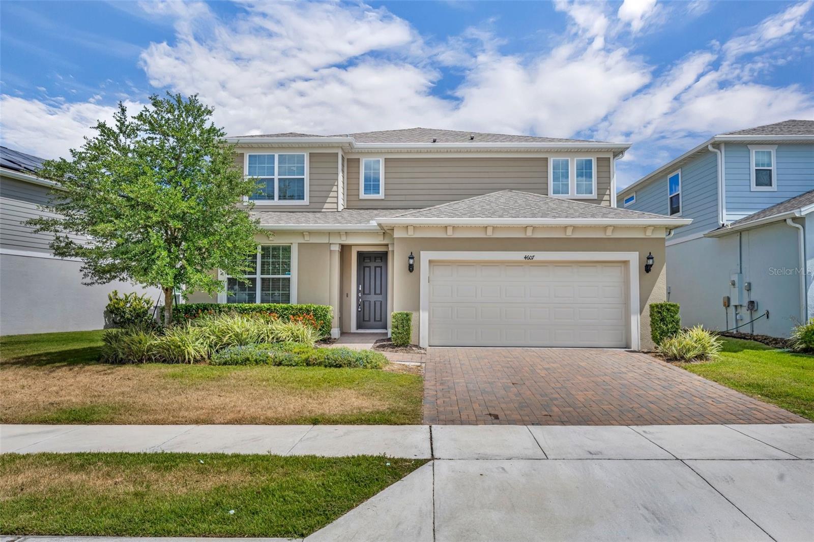 One or more photo(s) has been virtually staged. Welcome to this stunning 5-bedroom, 3.5-bathroom home, a modern sanctuary built in 2022 and meticulously maintained for a turnkey lifestyle. Located in the exclusive, gated community of Lakeview Preserve, this residence offers an unparalleled blend of spacious living, smart design, and resort-style amenities. Step inside to an open-concept floor plan designed for seamless flow and effortless entertaining. The heart of the home is a chef-inspired kitchen, featuring elegant granite countertops, a large working island, and a separate eat-in dining area. With fresh paint throughout the entire house, this space feels bright, modern, and ready for you to make it your own. Beyond the main living area, a dedicated flex space provides the perfect setup for a private home office or study. Ascend the stairs to discover a versatile and spacious loft, thoughtfully pre-wired for a projection system and surround sound—a perfect media room for movie nights or family gatherings. The home offers five generous bedrooms, including a tranquil primary suite, providing ample space for family and guests. The three and a half bathrooms are beautifully appointed, ensuring comfort and convenience. Enjoy the best of Florida living from your expansive, covered rear lanai, perfect for year-round relaxation and entertaining. The practical features of this home are equally impressive, including a three-car tandem garage with an electric vehicle charging plug, and recent additions of gutters, blinds, ceiling fans, and upgraded light fixtures. This home is more than a residence; it's a lifestyle. Lakeview Preserve is a true waterfront community with access to Johns Lake for non-motorized water sports. Residents enjoy a wealth of amenities, including a resort-style pool, a playground, splash pad, park, and clubhouse with a fitness center and community cabana. With acres of conservation areas, it's a paradise for outdoor enthusiasts, all while being conveniently located near shopping, dining, and entertainment. This is your opportunity to own a piece of paradise in one of the most sought-after communities. Schedule your private tour today and experience the luxury and convenience of Lakeview Preserve living.