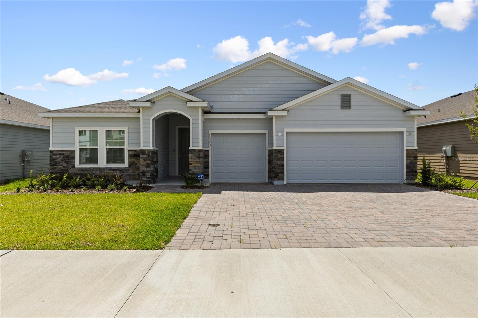 This stunning one-story home is perfect for multi-generational living, featuring five spacious bedrooms and three modern bathrooms. Among its highlights is a unique suite with a private room, bathroom, sitting area, and kitchenette, ideal for in-laws or guests seeking privacy. The home boasts an open-concept great room that connects seamlessly to a formal dining area and a well-appointed kitchen, complete with new stainless steel appliances like a range, two refrigerators, a microwave, and a dishwasher. A cozy dinette area overlooks the expansive covered lanai, perfect for outdoor entertaining. The thoughtfully designed layout includes two bedrooms at the front with a convenient Jack-and-Jill bathroom, while the multi-gen suite is strategically placed for added convenience. The primary bedroom, a private retreat, features an ensuite bathroom and offers stunning backyard views. Additional features include an expansive three-car garage and an attractive paver driveway, combining practicality with luxury. The Cherry on Top is this house backs up to an expansive preserve retention so the views from the living room and master bedroom are unmatched in comparison to other lots that do not face this area.