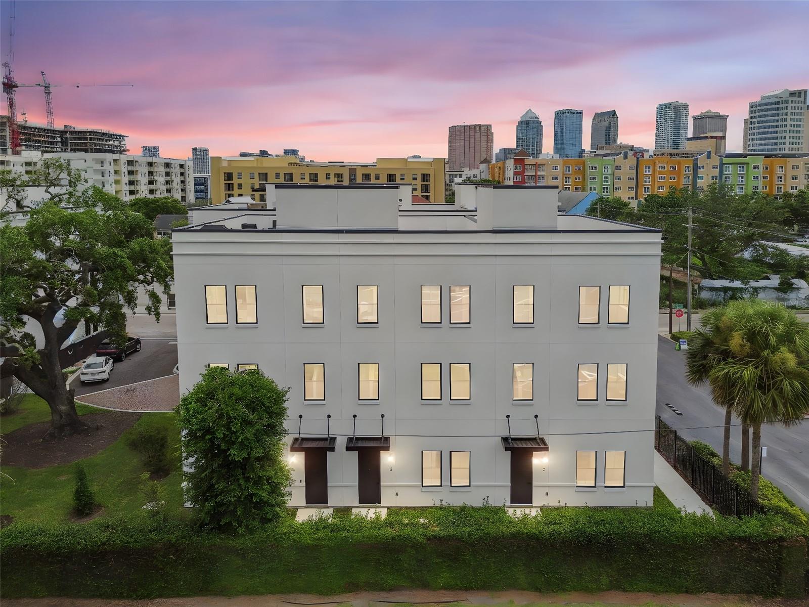 Step into the heartbeat of Tampa’s most electric neighborhood with Canvas City Homes GWX, a limited collection of industrial-chic city homes inspired by the bold spirit of Ybor City. This is where historic brick cigar factories meet modern design, where art, culture, and nightlife collide just outside your door. From the street-level entry to your private rooftop terrace with city skyline views, every detail is designed for life in motion. Inside, 10-foot ceilings, exposed block walls, and bright sunlit spaces create the perfect backdrop for your personal style. The ground floor sets the tone with polished concrete floors and a sleek ensuite bedroom. Upstairs, the massive kitchen island takes center stage, made for dinner parties, cocktails with friends, or Sunday morning brunch. On the top floor, the primary suite delivers main-character energy with double walk-in closets ready for your best fits. Step outside, and you’re minutes from Ybor’s buzzing restaurants, bars, and art studios, or hop on the streetcar to explore Downtown, Channelside, or Sparkman Wharf. With the transformative Gas Worx development rising just steps away, this neighborhood is only getting hotter, and Canvas GWX puts you in the front row. Whether you’re looking for a primary residence or investment property, Canvas GWX puts you ahead of the curve in one of Tampa's fastest-growing neighborhoods. Secure your spot today and call Canvas GWX home in the city’s most vibrant district. Move-in ready homes are available now, with limited-time buyer incentives.