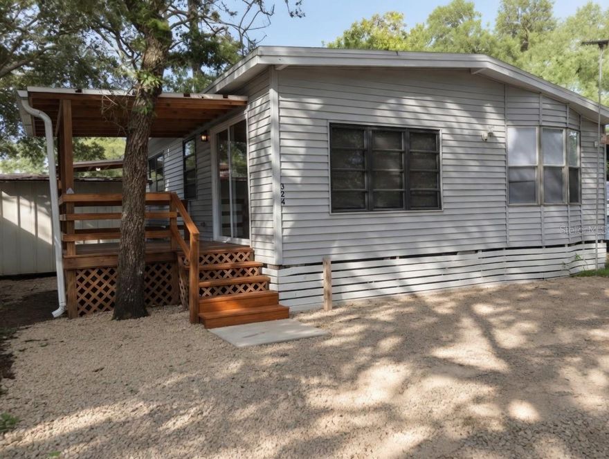 Beautiful, well-maintained oversized 3 bedroom, 1 bath mobile home in the popular Clarcona Resort community. This 916 sq ft home features recent updates including a newer roof, A/C, and plumbing. Enjoy resort-style living with pool, clubhouse, playground, and 24/7 gated security.