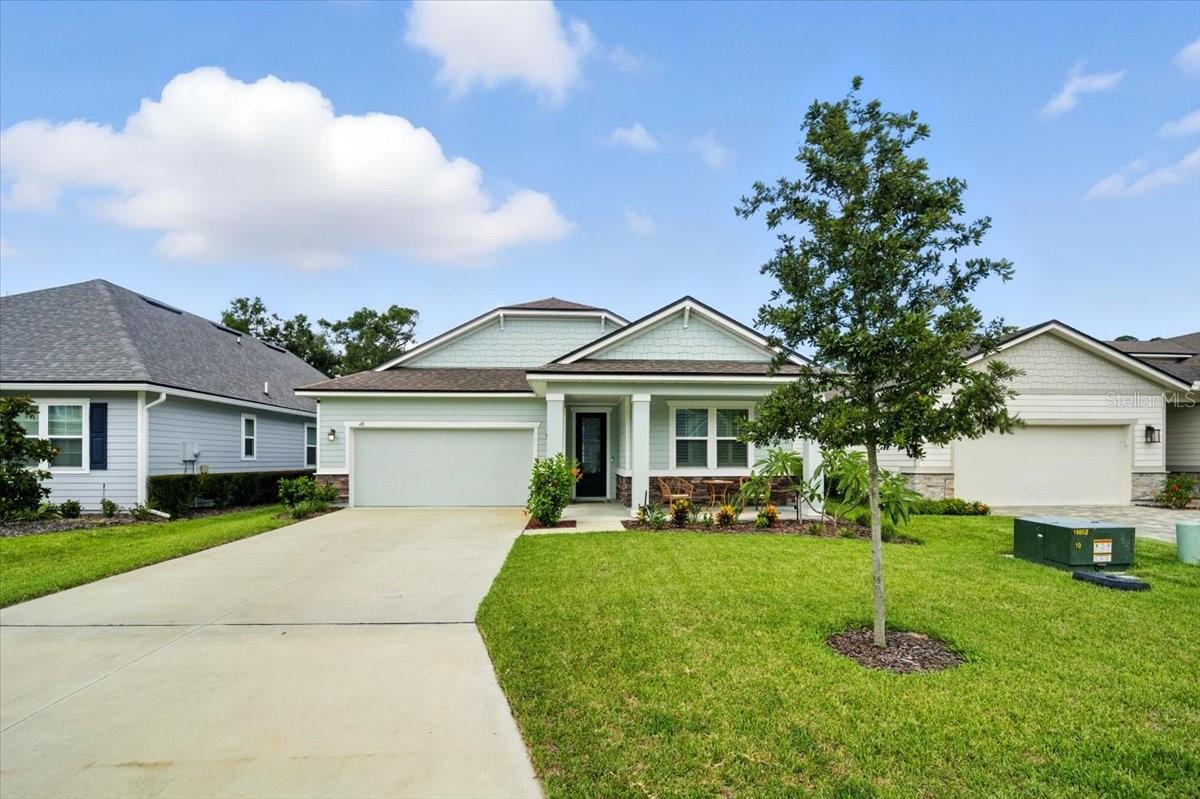 Beach Life at Its Best! This stunning 3-bedroom, 2-bath home—built in 2023—is just steps from the sand and ready for you to enjoy. Featuring a spacious, open floor plan, the home’s heart is a bright white kitchen with a large island, perfect for entertaining in style. The kitchen opens to a generous family room and breakfast nook that’s large enough to serve as a formal dining area.
The split-bedroom layout ensures privacy for everyone. The luxurious primary suite boasts a spa-like bath with a huge walk-in shower, dual vanities, and a spacious walk-in closet. Guests or family will appreciate their own private wing with two bedrooms and a shared bath.
Step outside to your private oasis—a beautifully landscaped, fenced backyard with a large covered porch, perfect for relaxing or dining al fresco. This small, friendly beach community, with very low HOA fees , offers a peaceful lake with a walking trail, community garden, kids playground and you’re just a short walk or golf cart ride to miles of pristine beach. Outdoor enthusiasts will love the endless walking and biking trails right outside the neighborhood.
Ideally located in one of the Hammock’s best-kept secrets, you’re minutes from fantastic dining, shopping, the Palm Coast bridge, and the Yacht Harbor Marina. This home is truly the perfect blend of coastal charm, modern luxury, and convenience!