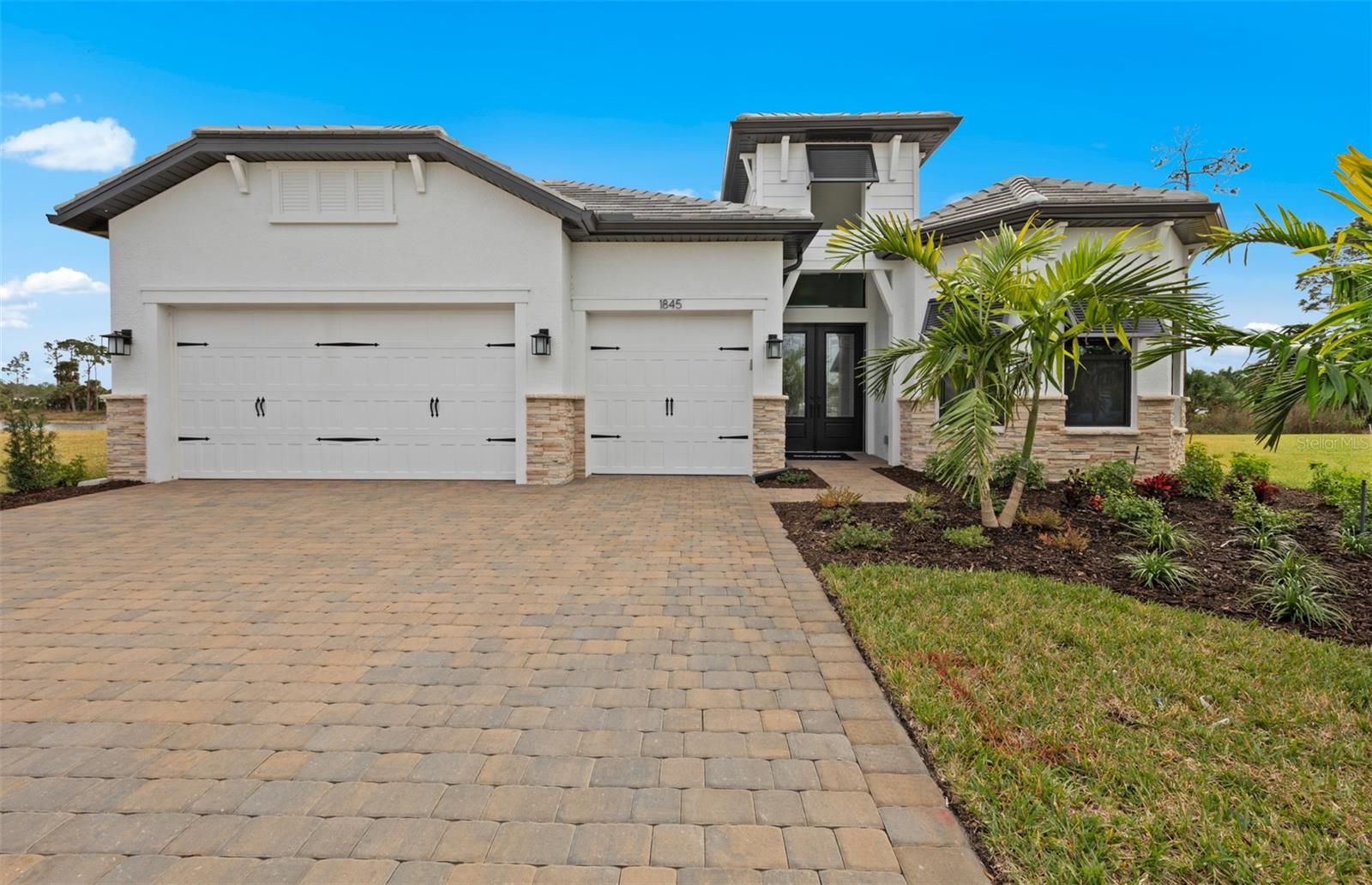 Move to Beachwalk in this beautiful Layton model with a water view, outdoor kitchen pre-plumb, stacked cabinets in the
kitchen, free standing tub in the owner's bath, door at owner's suite to lanai, full laundry upgrade, pool bath and so much
more.. The amenities features 21 sports courts including pickleball, tennis and bocce ball, a resort style pool with a beach entry and attached lap pool with multiple swim lanes, boardwalk with a kayak launch, memorial garden, community garden, dog park, miles of trails, gated entry with guard, second gate to Manasota Beach road, full time activity director, and an 11,000 sq ft fitness center featuring a cafe and 2 restaurants scheduled to open early 2025.