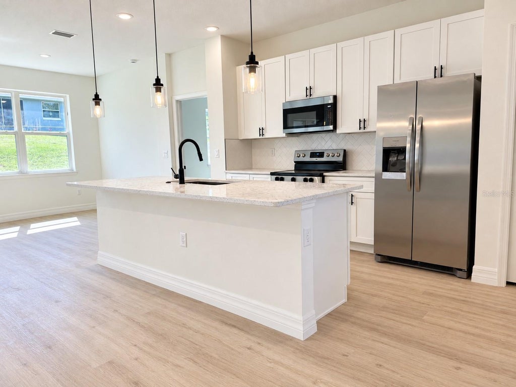 Photo of 8203 N Triana Drive, Citrus Springs, FL 34434 (MLS # O6443310)