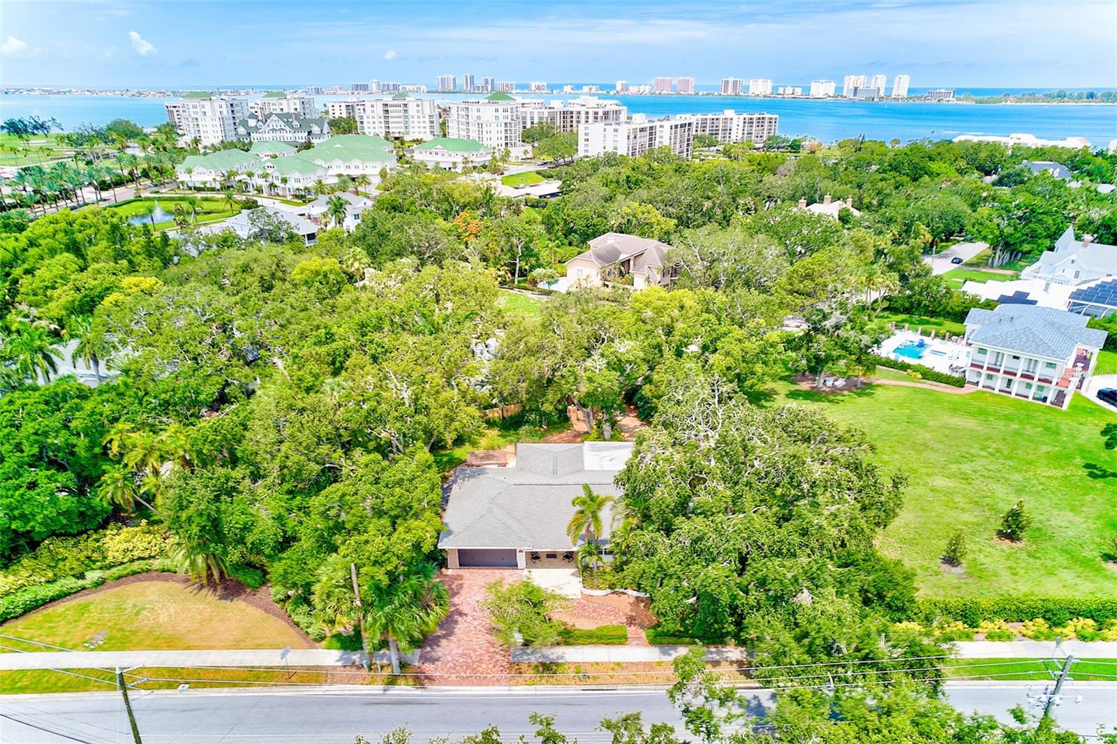 Welcome to your dream home in an unbeatable prime Belleair location, just steps from the exclusive Belleair Country Club, the historic Belleview Inn and Clearwater Bay. Nestled on an oversized lot across from hole #17 on the private Belleair Golf Course, this 3 bedroom, 2.5-bathroom residence offers luxury, privacy and resort style living in one of Florida’s most coveted neighborhoods. Step inside this charming cottage ranch-style home, where modern updates blend seamlessly with timeless character. The open layout welcomes you with warmth and elegance, featuring a combined living room, dining room and great room-perfect for entertaining.
The gourmet galley kitchen with vintage meets modern flair is a chef’s delight, boasting quartz countertops, stainless steel appliances and a stylish modern backsplash. A built-in breakfast nook adds a cozy touch, while shiplap and brick accents throughout the home create a one-of-a-kind aesthetic. The spacious primary suite is a true sanctuary, complete with a massive walk-in closet and a serene spa-like bathroom. An attached office features a custom picture window overlooking a lush garden-ideal for a peaceful workspace. Step outside to your private tropical paradise, complete with newly paved patio and pergola that invites relaxation. The Chicago brick driveway and covered front porch add to the home’s irresistible curb appeal. This home is high and dry-not located in a flood zone or evacuation area! Built for peace of mind, it’s hardwired for a generator and has a proven track record of maintaining power even during storm season!