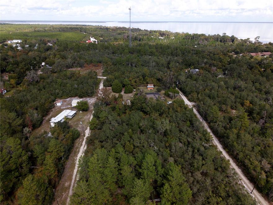 Fort McCoy, FL (Sportsman’s Haven Unit 2 – Lots 4, 5, 14 & 15) Welcome to a generous double-lot opportunity in the peaceful countryside of Fort McCoy, Florida. Located in Sportsman’s Haven Unit 2, this property spans the south 150 feet of the north 296 feet of the east 110 feet of the west 550 feet of the NW 1/4 of the SE 1/4—a tucked-away stretch of land offering both privacy and potential. This parcel brings together the best of rural Florida living. Lightly wooded and quietly removed from the noise of town, the land feels like a small clearing in life’s busyness—ready for a cabin, manufactured home, recreational retreat, or a long-term hold. Power runs nearby, and access is straightforward, giving you a workable foundation for whatever you choose to build. The surrounding area is a haven for anyone who likes to trade pavement for pine needles. You’re close to Lake Kerr, Salt Springs, and the Ocala National Forest, with endless options for boating, fishing, hunting, trail riding, and exploring Florida’s natural springs. Fort McCoy provides everyday essentials, while Ocala is an easy drive for anything bigger—groceries, healthcare, or a night out that doesn’t require fireflies for lighting. Whether you’re looking for an affordable build site, a recreational getaway, or a smart addition to your land portfolio, these two adjoining lots offer a versatile canvas in one of Marion County’s most outdoor-friendly regions. Parcel ID 1692-003-014