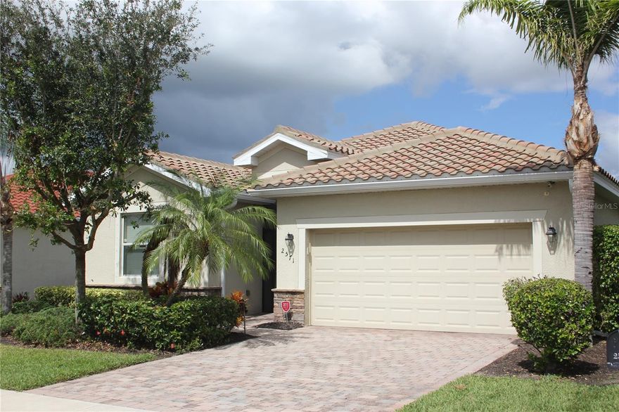 One or more photo(s) has been virtually staged. Recent price reduction of $30,000 - Waterfront living at an affordable price! Come see this Beautifully designed 4BR/3BA single-story home with 2 car garage in the desirable gated community of Bella Vida! Enjoy peaceful lake and sunset views from the screened lanai and fenced yard. Featuring crown molding, 10’ ceilings, a 12’ grand entryway, and a spacious open floorplan, this home is perfect for entertaining. The kitchen offers granite countertops, a large island, walk-in pantry, stainless steel sinks and appliances and abundant wood cabinetry. The split-bedroom layout includes a primary suite with garden tub, walk-in no-step shower, dual-sink vanity, and private water closet. You will enjoy the spacious primary bedroom walk-in closets with premium closet shelving and storage! Community amenities include a resort-style pool, fitness center, pickleball, tennis, basketball, volleyball, soccer, library, and playground, plus social clubhouse events. Lawn care and cable are included in the HOA. Located near shopping, dining, and downtown Fort Myers, this home combines elegant living, convenience, and resort-style comfort in one of Cape Coral’s premier neighborhoods! make your appointment to see this fine home today!