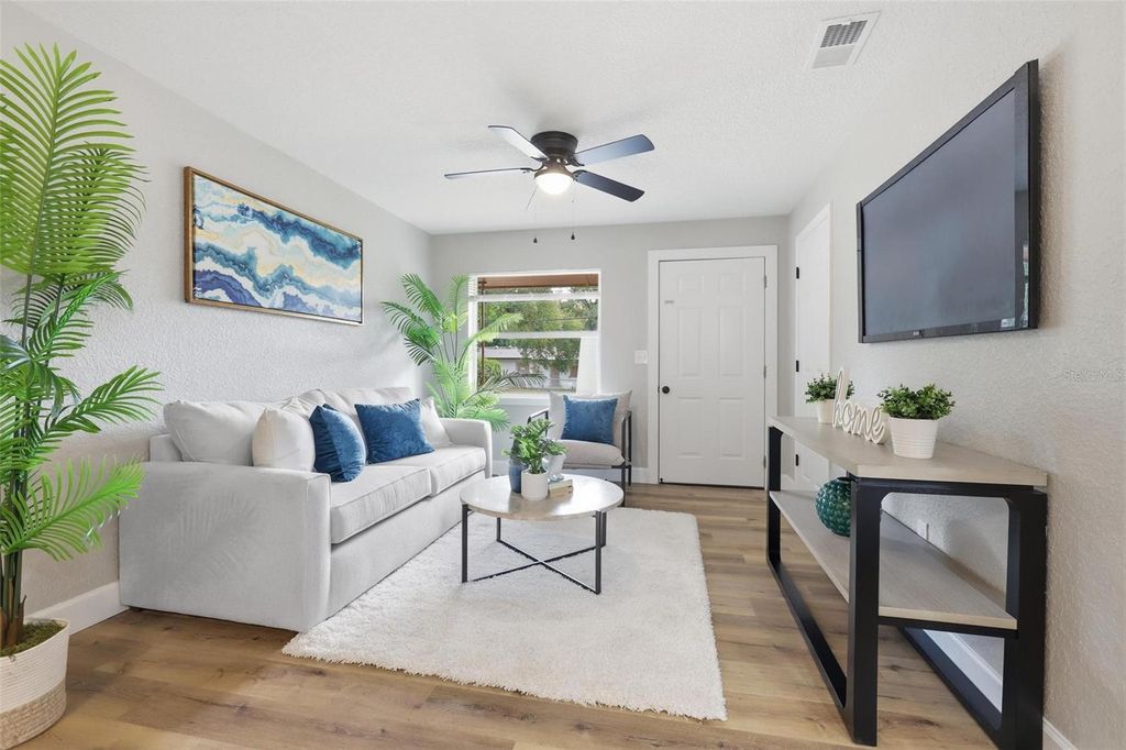Photo of 225 W Volusia Avenue, Deland, FL 32720 (MLS # V4946885)