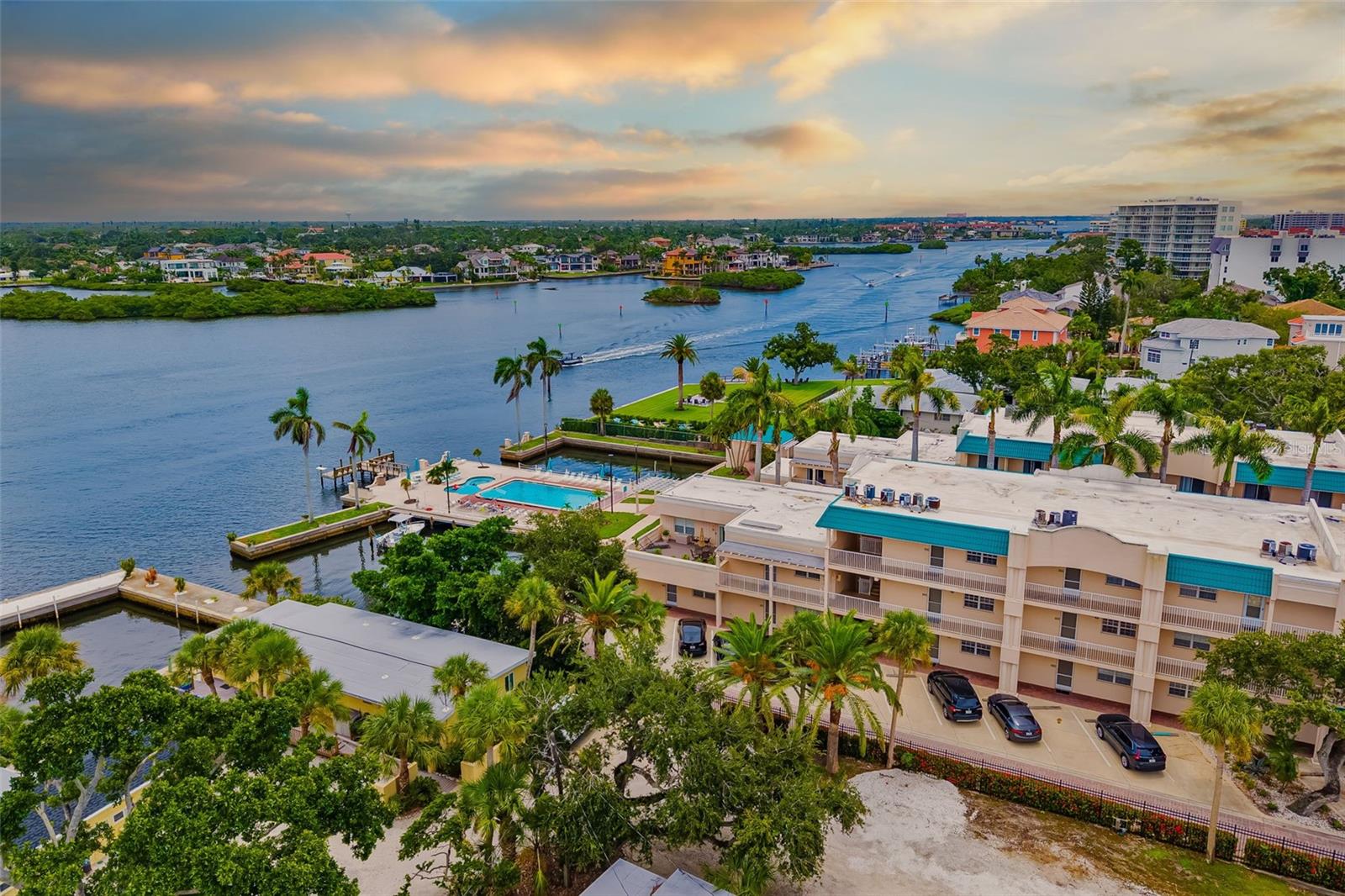 Looking for the perfect balance of location, lifestyle and income potential? This one delivers all three. Welcome to your slice of paradise on world-renowned Siesta Key! This spacious 2-bedroom, 2-bath condo is located in the highly sought-after Palm Bay Club, offering the perfect blend of coastal living and resort-style amenities. Located on the second floor, step inside to an open-concept living and dining area filled with natural light. A bright, white kitchen with updated recessed lighting has a smart pass through, so your culinary creations flow to the dining room as easily as your conversation. The dining area, with seating for 6, as well as the living room are turnkey furnished with attractive, neutral décor. Large windows and hurricane rated sliding glass doors lead to a private balcony, creating a seamless indoor-outdoor flow that’s perfect for enjoying the saltwater breeze. Both bedrooms are generously sized, with the primary suite offering an en-suite bath and walk-in closet. The second bedroom is equally comfortable and en-suite as well, making it perfect for guests or family with plenty of privacy for all. The Palm Bay Club is a beach-to-bay community that boasts top-tier amenities, including two heated pools, tennis courts, a fitness center, and private access to the powdery white sands of Crescent Beach. Boat docks, fishing areas, and a bayside barbecue pavilion complete the resort-like experience. This condo offers the ultimate in beachside convenience—minutes from Siesta Key Village, shopping, dining, and entertainment. With its unbeatable location and flexible rental policy, it’s a fantastic opportunity for both personal use and income potential. Don’t miss your chance to own a piece of the Siesta Key lifestyle at The Palm Bay Club. This condo is ready for you to make it your own coastal escape!