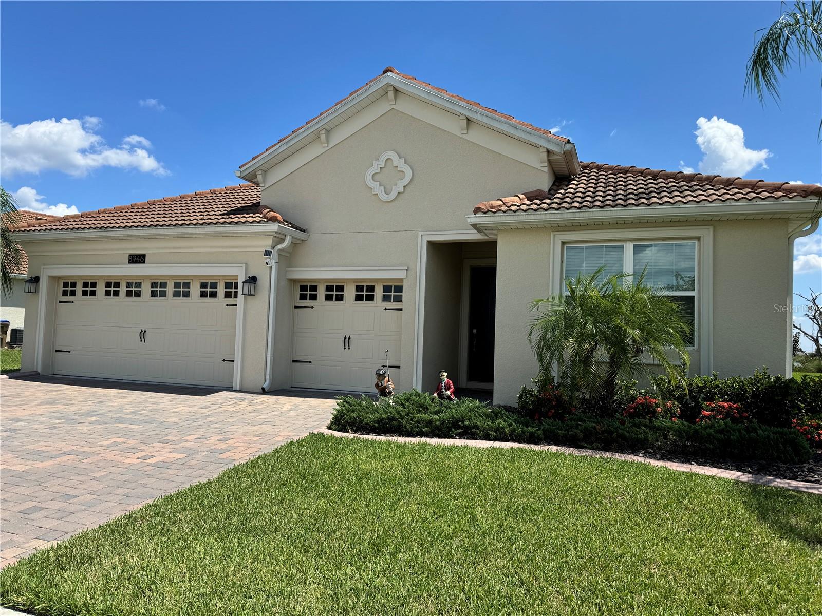 Beautiful newer 4BR/3BA home in the highly desirable gated community of ChampionsGate Country Club. This property features a 3-car garage, wide sliding patio door, and an extended lanai with panoramic birdcage, perfect for taking in the serene nature views. Added touches include gutters with concrete downspouts.
Enjoy a golf cart friendly neighborhood with unmatched resort-style amenities included in the HOA: 18-hole championship golf course with full country club membership, putting, chipping and driving ranges, multiple gyms, pickleball, tennis, sand volleyball, arcade, movie theater, tiki bar, on-site restaurants & bars, pools, spas, splash pads, water slides, and a lazy river. Lawn maintenance and Spectrum platinum package (internet/phone/cable) are also included. $75 of the HOA is a dining & drink credit at the residents plaza. Weekly community events and the morning sight of hot air balloons drifting across the golf course make this lifestyle truly unique.