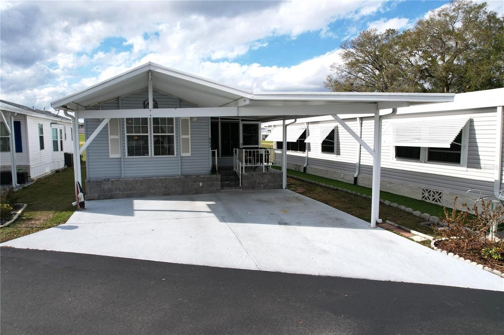 Photo of 603 Arnold Palmer Drive, Davenport, FL 33837 (MLS # O6452870)