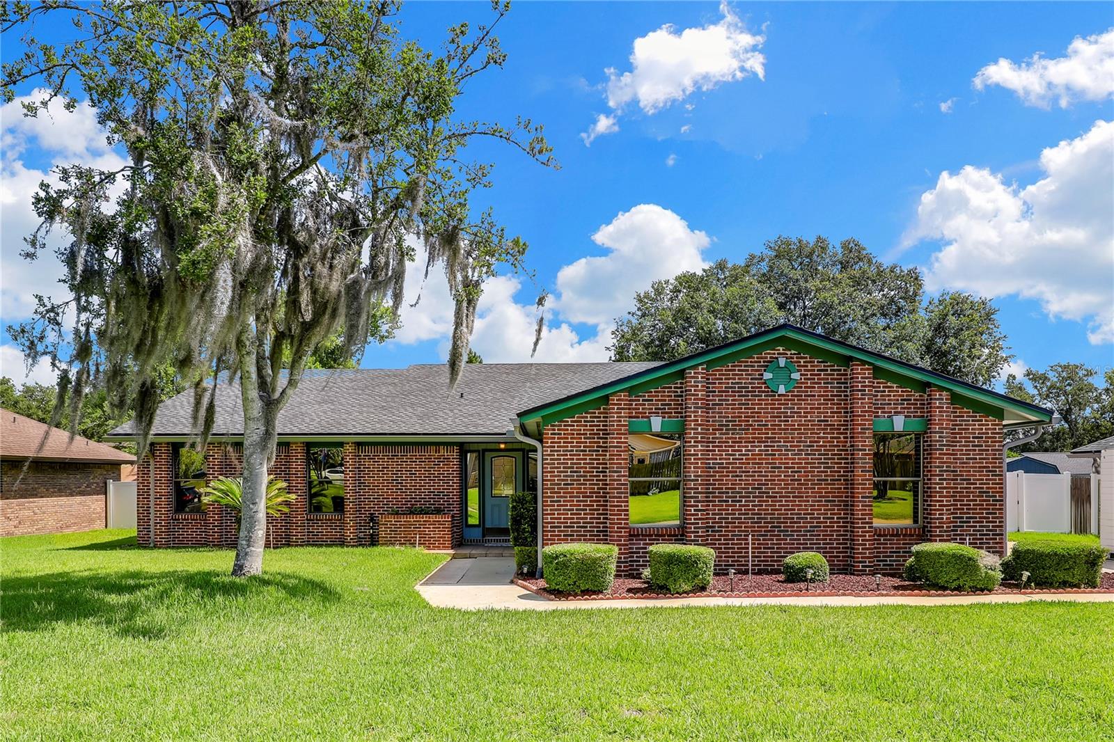 **NO-FLOOD AREA**NO HOA**NO CDD** Discover charming and elegant living in this bright and open 3-bed/2-bath home! Tile flooring extends throughout the main living areas, leading you to a spacious living room featuring a beautiful BRICK FIREPLACE and a VAULTED CEILING with an EXPOSED WOODEN BEAM. The kitchen boasts lovely cabinetry and a view of the fireplace, creating a cozy and connected space. A VERSATILE BONUS ROOM provides endless possibilities. The living room, dining room, and bonus room feature sliding glass doors that open onto a patio complete with a hot tub for ultimate relaxation. Outside, you'll find a huge, FULLY FENCED YARD with a convenient SHED, plus a spacious side yard with double gates, ideal for storing an RV, boat, or other recreational vehicles. Tucked away in a great neighborhood, this home offers convenience with easy access to Blanding Blvd and tons of shopping and dining. This beautiful home won’t last long, don’t miss out!