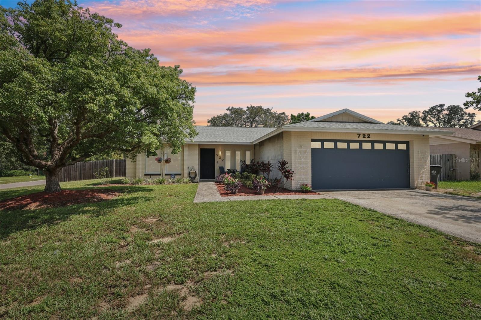 Welcome to 722 Sunlit Ct — a beautifully updated 3BR/2BA pool home tucked on a quiet cul-de-sac in the heart of Brandon. This move-in ready property blends modern upgrades with Florida comfort, all with no HOA or CDD fees. Step inside to find vaulted ceilings, beautiful stone fireplace, tile flooring in the main areas, and epoxy-coated bedroom floors for a sleek, low-maintenance finish. The kitchen is light and bright with white shaker cabinets, fresh paint, granite countertops, and newer stainless steel appliances. Both bathrooms have been fully renovated, including an expanded primary en-suite with dual vanities, walk-in tile shower, and stylish finishes. The spacious primary suite also offers direct access to the pool. Out back, unwind in your own private oasis with a screened-in lanai, sparkling pool, newer heater, pump, and filtration system, a covered lanai, and a large fenced yard perfect for entertaining or relaxing. Additional features include a newer roof, interior paint throughout, and an HVAC system with UV air purification. Centrally located near shopping, dining, schools, and major commuter routes — this one is the total package!