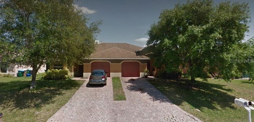 Beautiful Mediterranean duplex featuring an open concept design with all-tile flooring and high cathedral ceilings. The home includes wood doors and cabinets in the kitchen and bathrooms. It comes with window treatments, granite countertops in both the kitchen and bathrooms, and stainless steel appliances. The property boasts a high-efficiency air conditioning system, a spacious garage, and a patio with ample room for a gazebo. Additionally, there is a washer and dryer hook-up inside.