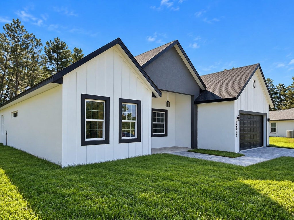 Photo of 4091 SW 130th Loop, Ocala, FL 34473 (MLS # O6449326)