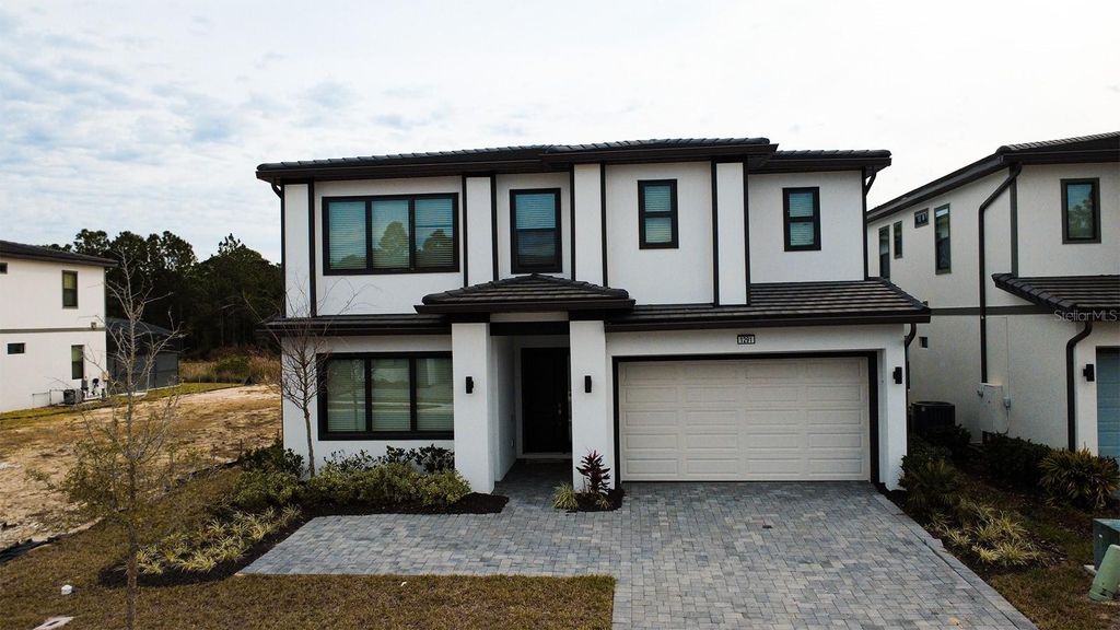 Photo of 1291 Butterfly Orchid Rd, Davenport, FL 33837 (MLS # S5142099)