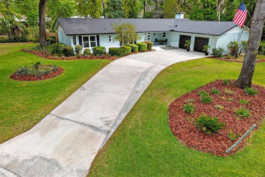 Move-in ready fully remodeled 4BR/2BA pool home on a rare ¾ acre lot in highly desirable NW Gainesville, just minutes from Millhopper Shopping Center and The Fresh Market.
This beautifully updated home is approximately 2,500 sq ft of thoughtfully designed living space with multiple living areas, with wood & tile floors throughout.  It includes a spacious main living room, separate family/TV room, and formal dining area—well-suited for both everyday living and entertaining.
The updated custom kitchen features modern finishes, ample quartz countertops with plenty of counter space, and a functional layout that flows seamlessly into the main living areas. Recent upgrades throughout the home include a newer roof, updated plumbing, new windows, new HVAC, new garage doors & front entry doors. Recently painted exterior, new water heater, new 200 amp main service disconnect & EV charger and extensive interior renovations, providing peace of mind and true move-in ready convenience.
The primary suite has a comfortable private retreat with an updated en-suite bathroom, while additional bedrooms provide flexibility for guests, home office, or family needs. Both bathrooms have been updated with clean, modern finishes.
Step outside to your private backyard oasis featuring a resurfaced pool surrounded by an expansive travertine deck—just right for relaxing or entertaining. The oversized ¾ acre lot with irrigation system & natural gas connection to grilling station, provides rare space, privacy, and endless possibilities for outdoor living and recreation.
Located in one of NW Gainesville’s most sought-after areas, this home combines convenience and tranquility with easy access to shopping, dining, and major roadways. Enjoy close proximity to Millhopper Shopping Center, The Fresh Market, and everything the area provides, while still enjoying a quiet residential setting.
Highlights include: fully remodeled interior, 4 bedrooms, 2 bathrooms, ~2,500 sq ft, ¾ acre lot, private pool, travertine deck, newer roof, updated plumbing, new windows, multiple living spaces, and prime NW location. Agents Welcomed!