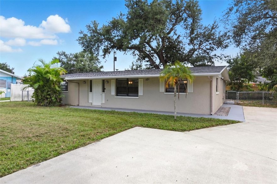 **OLD FLORIDA LIVING NEAR BEACHES**  Welcome to 101 Oberlin Rd in beautiful Venice, Florida—where Old Florida charm meets modern comfort. This inviting 3-bedroom, 2-bathroom concrete block home offers 1,427 square feet of well-designed living space surrounded by mature moss-draped oaks and just minutes from Manasota Key and the stunning Gulf beaches. Inside, you’ll find a thoughtful split floorplan with an open-concept kitchen and dining area that flows seamlessly into the tile-floored living room. The newer kitchen features a peninsula layout with white cabinetry, quartz countertops, stainless steel appliances, and a breakfast bar for two, creating a bright and welcoming hub for everyday living. Luxury vinyl flooring enhances the dining area and bedrooms for a clean, cohesive look throughout. The primary bedroom offers privacy on one side of the home, with luxury vinyl floors, a wall-long closet, and access to an updated hall bathroom featuring a subway-tiled walk-in shower, white hexagonal shower floor tile, plank-style tile flooring, white vanity with quartz countertops, and water-saving low-flow toilets. A door near the primary bath allows for easy grocery access or a separate entry to the primary wing. On the opposite side of the home, two comfortable guest bedrooms with luxury vinyl flooring share a full hall bath featuring a tub/shower combo with subway tile surround and well-maintained white cabinetry. Every room is equipped with ceiling fans for comfort, and a convenient hall closet adds extra storage. Off the dining area, sliding glass doors open to a fully finished Florida room that provides additional living space and overlooks the fully fenced backyard. The Florida room is climate controlled by its own 2021 mini-split AC system, making it perfect for relaxing year-round. Just off the Florida room is a utility space with laundry hookups, backyard access, and a tankless hot water heater along with well equipment. The backyard is shaded by a beautiful old oak tree, creating a peaceful outdoor retreat ideal for gatherings or quiet mornings. Practical updates include a central HVAC system installed in 2019 and a roof replacement completed in April 2022, providing peace of mind for years to come. Located in a serene, established neighborhood filled with mature landscaping and Old Florida character, this property offers easy access to local dining, shopping, parks, and some of Sarasota County’s most beloved beaches. With its blend of modern updates, timeless appeal, and prime location near Manasota Key, 101 Oberlin Rd is the perfect place to enjoy the relaxed coastal lifestyle that Venice is known for.