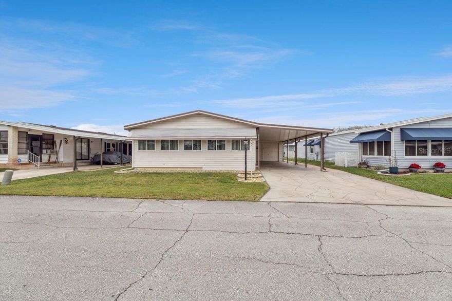 Welcome home to this well-loved, fully furnished 2-bedroom, 2-bath residence located in the desirable 55+ Lake-n-Golf Estates in sunny Winter Haven. Situated on land you own, this 1985 home offers 1,144 square feet of comfortable living space with peace of mind provided by a new roof, new carport, new windows, and new flooring/carpet throughout.

The bright and functional floor plan features spacious living and dining areas, a well-appointed kitchen, and two generously sized bedrooms, including a primary suite with a private bath. Being sold fully furnished, this home is truly move-in ready—perfect for seasonal or full-time living.

Lake-n-Golf Estates is a low-HOA, active community set on the shores of beautiful Lake Henry, offering outstanding amenities including a community pool, hot tub, clubhouse, dock, and boat ramp. Enjoy lakefront living, social activities, and a relaxed Florida lifestyle all in one welcoming neighborhood.

Conveniently located near shopping, dining, medical facilities, and major roadways, this home is an excellent opportunity to enjoy affordable, low-maintenance living in a friendly 55+ lakefront community.