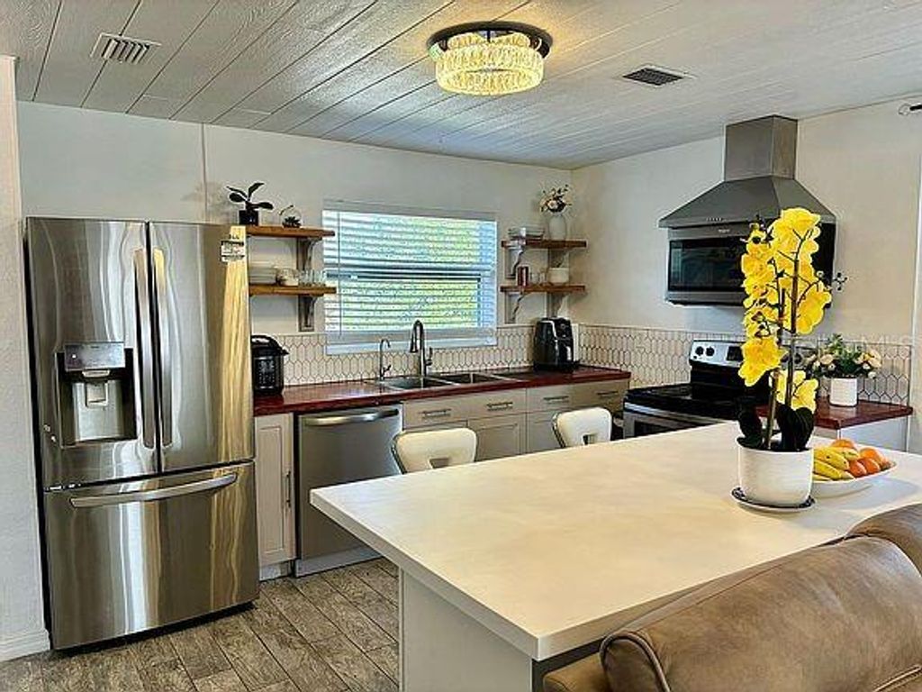 Photo of 5106 Blue Heron Drive, New Port Richey, FL 34652 (MLS # O6367020)