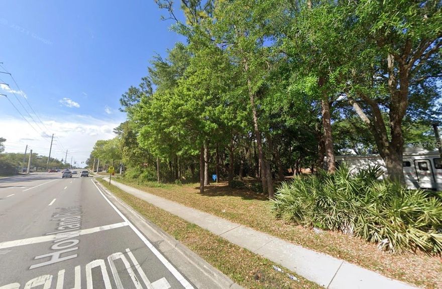 Newly listed 0.26-acre lot in the Deltona Lakes neighborhood. This property offers a great location with mature trees, public road access, and no HOA. The lot appears to have access to some utilities, allowing for a potentially quick and easy build. Zoned for possible commercial use (buyer to verify), this parcel provides excellent opportunity for investors or future development. The buyer is responsible for confirming utilities, zoning, restrictions, and all property details. Listing is for land only. Great investment—don’t miss this versatile lot in a growing area!
