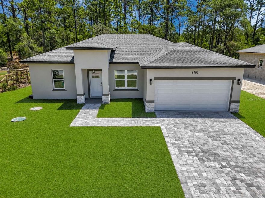 BEAUTIFUL NEW CONSTRUCTION HOME in Citrus Springs featuring 3 bedrooms, 2 bathrooms, and 1,860 total sq ft in a growing and desirable community. This modern home offers excellent curb appeal with an elegant paver driveway and contemporary finishes throughout.
Conveniently located near the Suncoast Parkway expansion, providing easy access to Tampa, Orlando, shopping, dining, medical facilities, and outdoor recreation. Less than 1.5 hours from both Tampa and Orlando, making this property ideal for full-time Florida living, a vacation home, or an investment opportunity.
The neighboring lot is currently under construction with a larger 4-bedroom home, helping enhance the value and appeal of the area. Inside, you’ll find a modern layout with stainless steel appliances included.
Located in the heart of Citrus Springs, known for its parks, biking trails, golf courses, and peaceful atmosphere. Move-in ready and easy to show through ShowingTime.