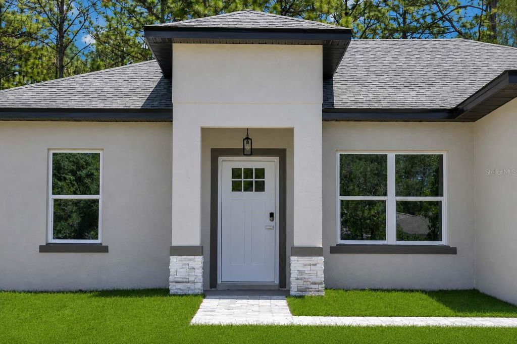 Photo of 8753 N Raidin Drive, Citrus Springs, FL 34433 (MLS # TB8505577)