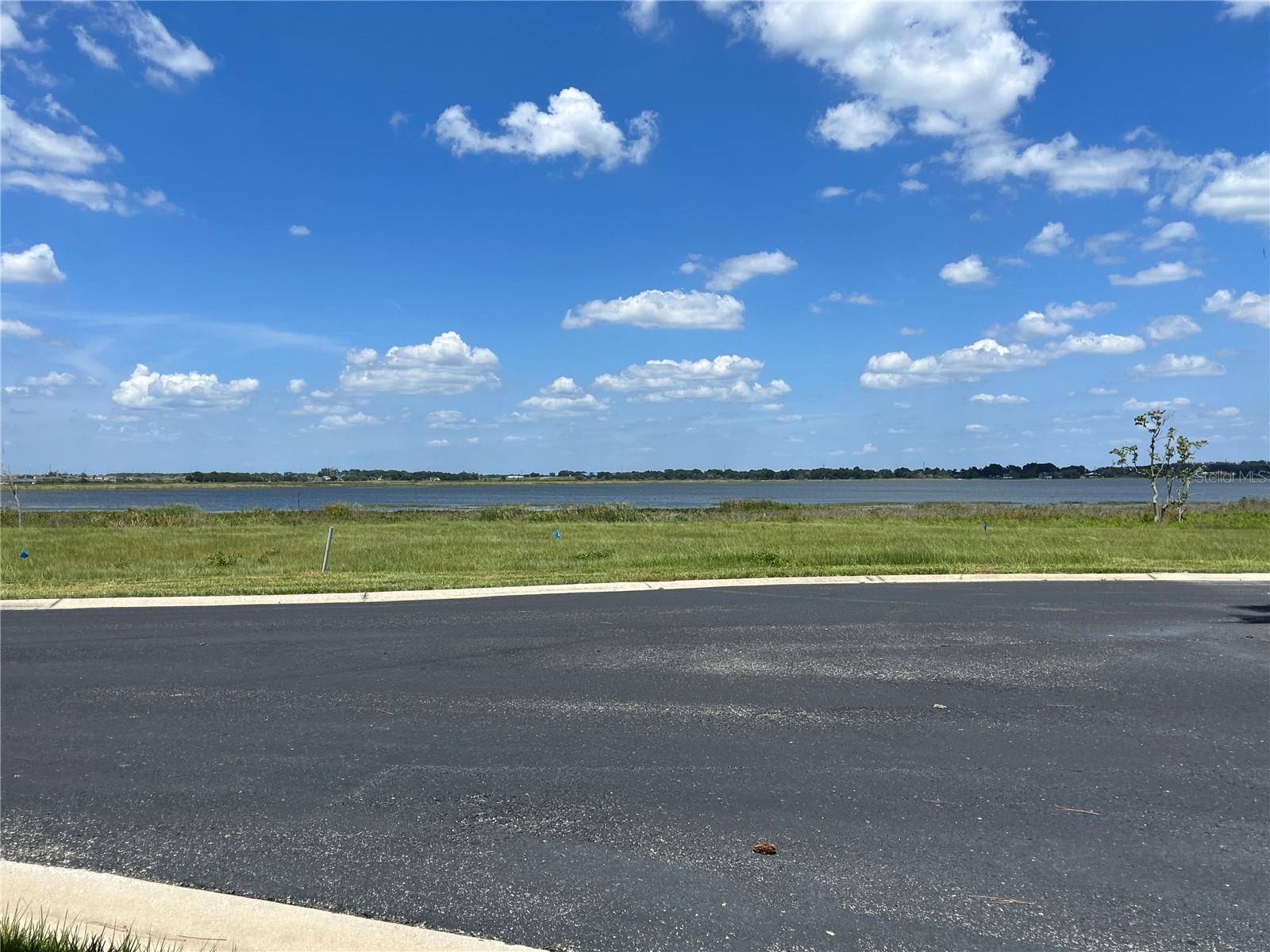 Reduced by $31K!!! Dreams Do Come True! Just what you've been looking for and at the right price. This vacant lot on Caladium Ave, is a magnificent waterfront property located in the highly sought-after gated community of Water Ridge Subdivision in Lake Alfred, FL. Situated on a generous .524-acre lot, this prime real estate offers an incredible opportunity to build your dream home in a serene and picturesque setting. Featuring breathtaking frontage to Lake Alfred, this property boasts a magnificent view of the shimmering waters, allowing you to indulge in a variety of water activities with a boat ramp close by or the possibility of building your own private ramp. Whether you're a boating enthusiast, love fishing, or simply enjoy the tranquility of lakeside living, this location is sure to exceed your expectations. The Water Ridge Subdivision provides a peaceful and exclusive environment for homeowners, offering a secure and private community to enjoy. Immerse yourself in the beauty of nature as you explore the meticulously maintained grounds, dotted with lush greenery and mature trees. Residents of Water Ridge also have access to a range of premium amenities, including two clubhouses, fitness center, three swimming pools, two tennis courts etc. With this size-able .524-acre lot, you'll have plenty of space to bring your architectural visions to life and create a home tailored to your desires. Whether you envision a sprawling estate or a cozy retreat, this blank canvas eagerly awaits your imagination. Lake Alfred is renowned for its idyllic scenery, charming small-town atmosphere, and convenient access to urban amenities. Located just a short drive from major cities such as Orlando and Tampa, you can enjoy the best of both worlds—peaceful lakeside living and the excitement of metropolitan attractions. Don't miss this incredible opportunity to own a waterfront property in the serene Water Ridge Subdivision. Embrace a lifestyle filled with natural beauty, and the serenity of lakeside living. Contact us today to schedule a private viewing and begin the journey of turning your dream home into a reality.