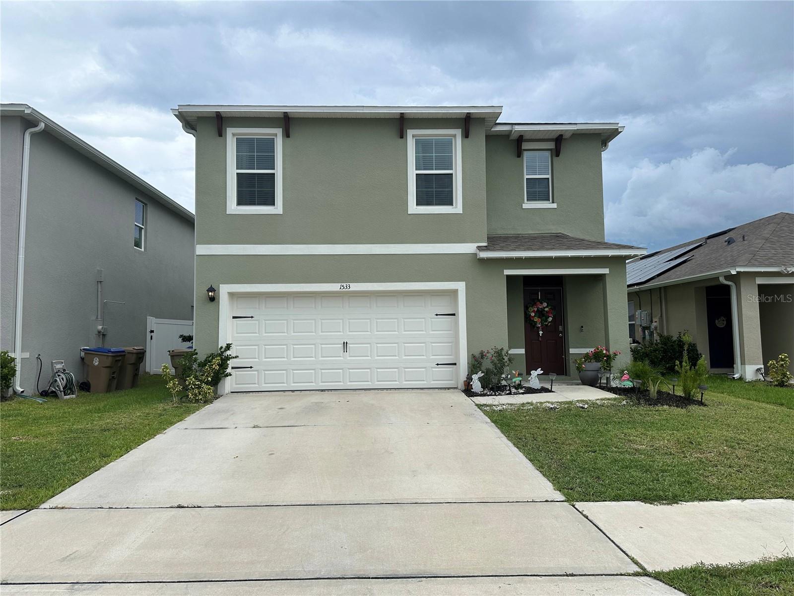 Discover this spacious 5-bedroom, 3-bathroom home nestled in a vibrant Central Florida community. Built in 2022, it features an open-concept layout, modern kitchen with stainless steel appliances, and a versatile downstairs bedroom ideal for guests or remote work. The upstairs primary suite offers dual vanities and a walk-in closet. Step outside to a fully fenced backyard with 6' vinyl privacy fencing—perfect for entertaining or relaxing. Residents enjoy access to resort-style amenities including a luxurious clubhouse, state-of-the-art gym, pool, playgrounds, and scenic walking trails. Conveniently located near major highways, shopping, dining, and top-rated schools. Move-in ready and designed for comfort, style, and convenience!